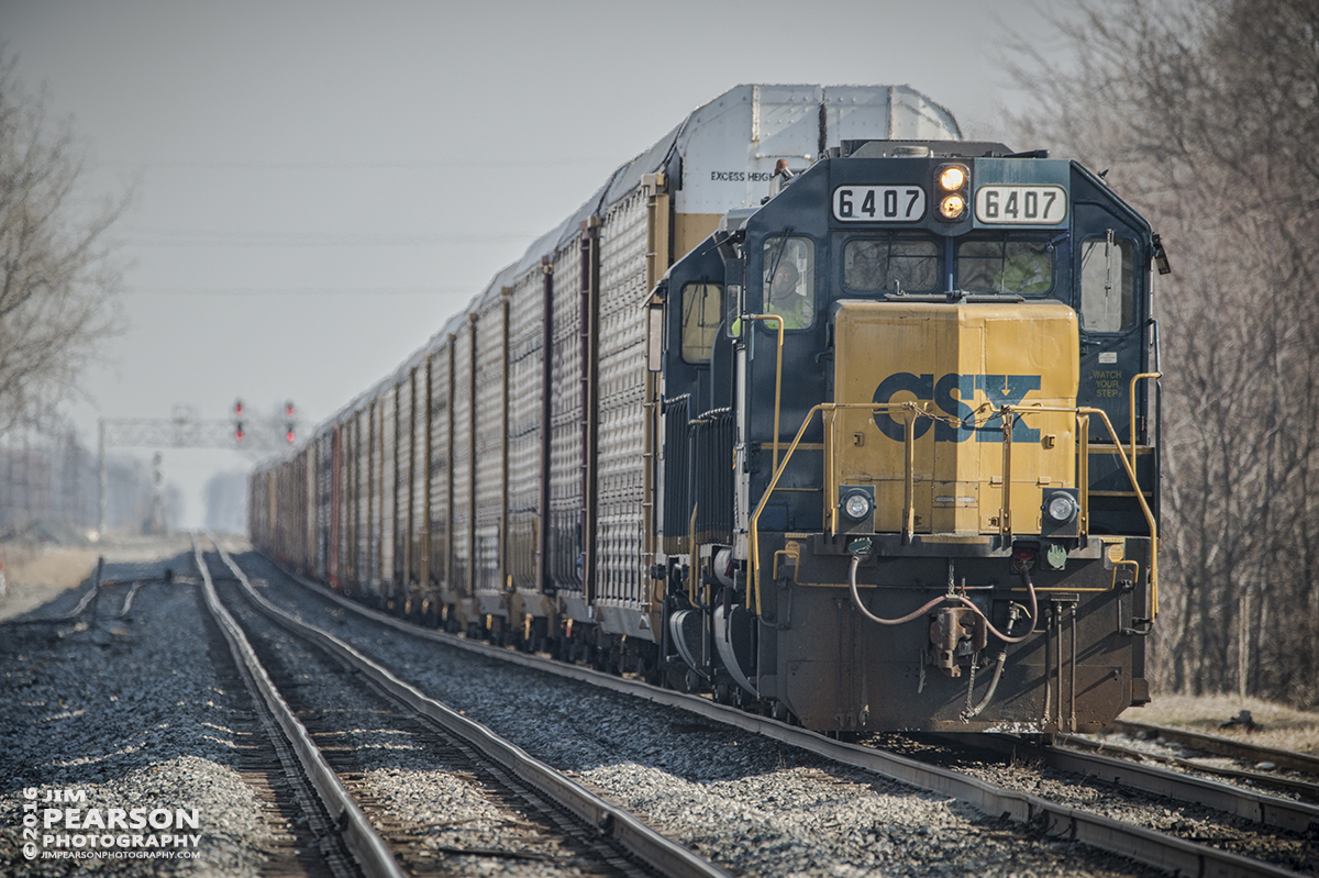 February 7, 2016 - The crew of a CSX autorack train, with engine 6407 in the lead, waits for a signal just short of Columbus Avenue crossing in Fostoria, Ohio so they can head west on the Williard Subdivision. - Tech Info: 1/1000 | f/6 | ISO 450 | Lens: Sigma 150-600 @ 500mm on a Nikon D800 shot and processed in RAW.