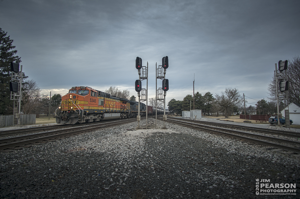 February 7, 2016 - At dusk a loaded eastbound CSX tank train, with BNSF 5346 leading, makes it's way over the NS Diamond, on CSX's Willard Subdivision, at Fostoria, Ohio. - Tech Info: 1/1000 | f/2.8 | ISO 200 | Lens: Nikon 18mm on a Nikon D800 shot and processed in RAW.