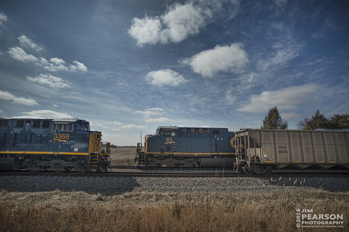 February 26, 2016 - During a three-way meet, CSXT 65 leads Q025 south as it passes a empty coal and grain train (3368, a ET44AH GE Tier 4 locomotive) in the siding at Slaughters, Ky, on the Henderson Subdivision. - Tech Info: 1/5000 | f/2.8 | ISO 100 | Lens: Nikon 18mm on a Nikon D800 shot and processed in RAW.