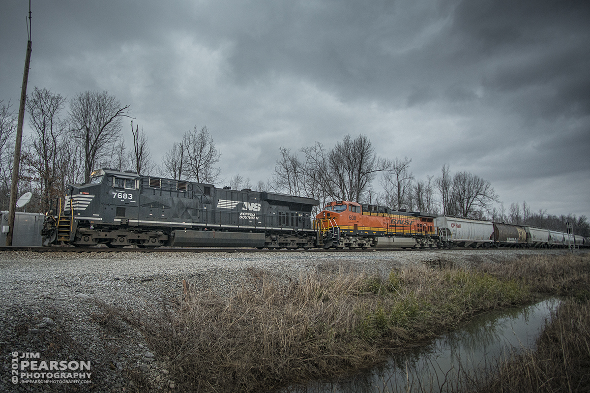 February 25, 2016  CSX Q647-24, with NS 7683 leading and BNSF 608 trailing, pulls out of the siding at the south end of Romney in Nortonville, Ky as it heads south on the Henderson Subdivision under stormy skies.  Tech Info: 1/1000 | f/2.8 | ISO 560 | Lens: Nikon 18mm on a Nikon D800 shot and processed in RAW.