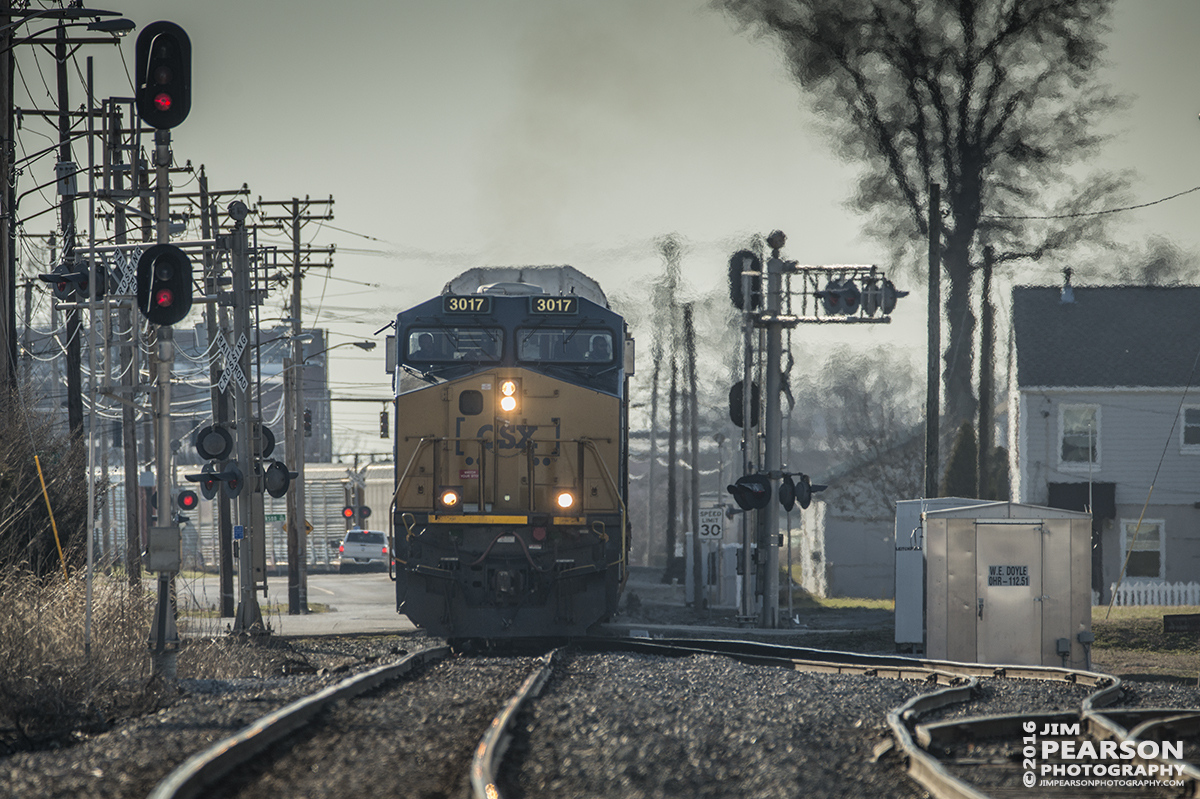 February 27, 2016 - A Eastbound loaded CSX autorack train, with CSXT 3017 leading, enters the west end of Doyle Yard at Owensboro, Ky as it heads east on the Louisville Division. - Tech Info: 1/800 | f/6 | ISO 140 | Lens: Sigma 150-600 @ 420mm with a Nikon D800 shot and processed in RAW.