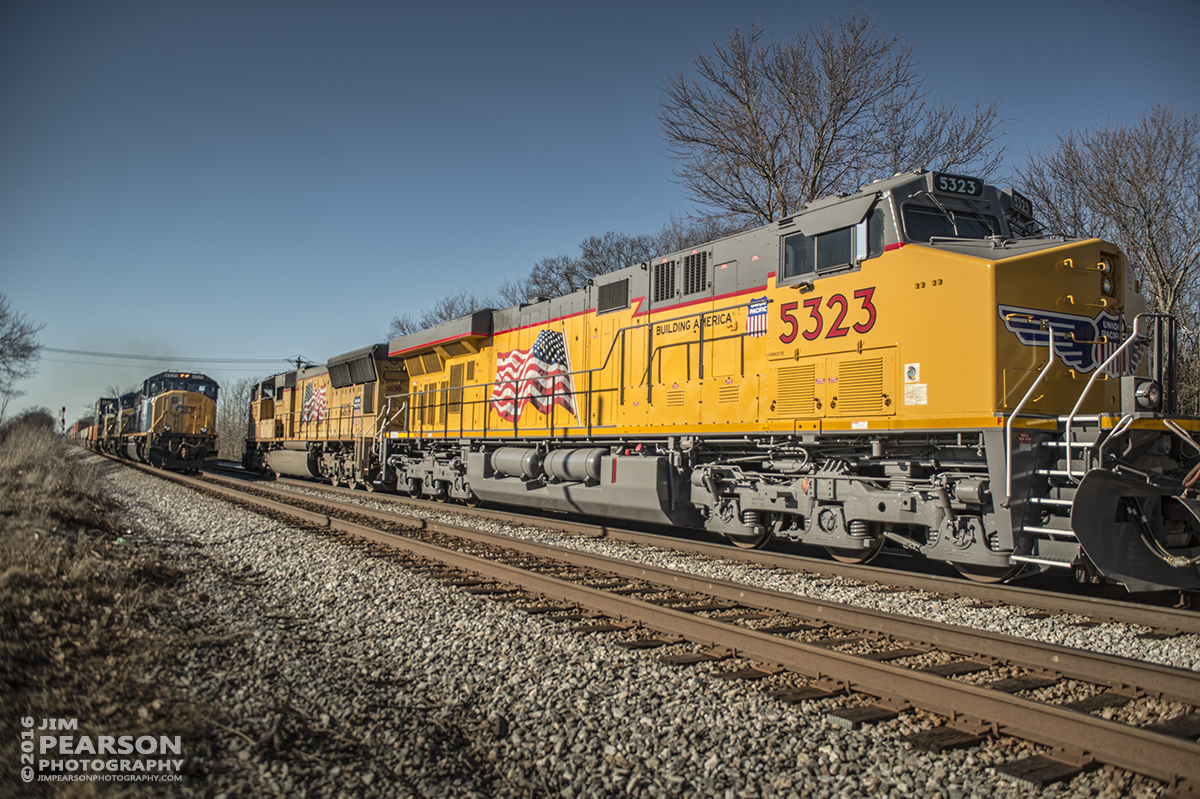 February 29, 2016 - Northbound CSX Q294, with Union Pacific power and #5323 (AC45CCTE) as the second unit, meets Q021 heading south at north Casky at Hopkinsville, Ky on the Henderson Subdivision. - Tech Info: 1/5000 | f/2.8 | ISO 100 | -2 stops | Lens: Sigma 24-70 @ 24mm on a Nikon D800 shot and processed in RAW.