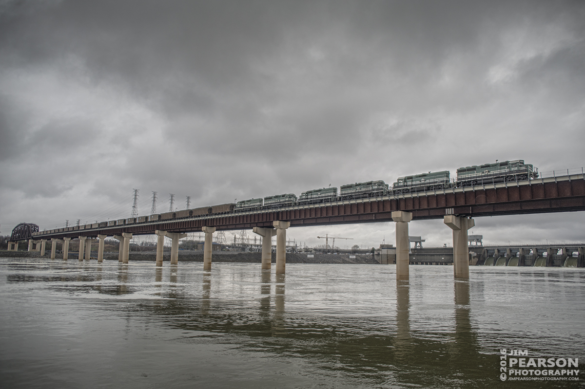 March 14, 2016 - Paducah and Louisville Railway's 2111 leads a lashup of six engines as they make their way south at Kentucky Dam with a loaded coal train at Gilbertsville, Ky.. - Tech Info: 1/8000, -.7 stop | f/2.8 | ISO 250 | Lens: Sigma 24-70 @ 24mm on a Nikon D800 shot and processed in RAW.