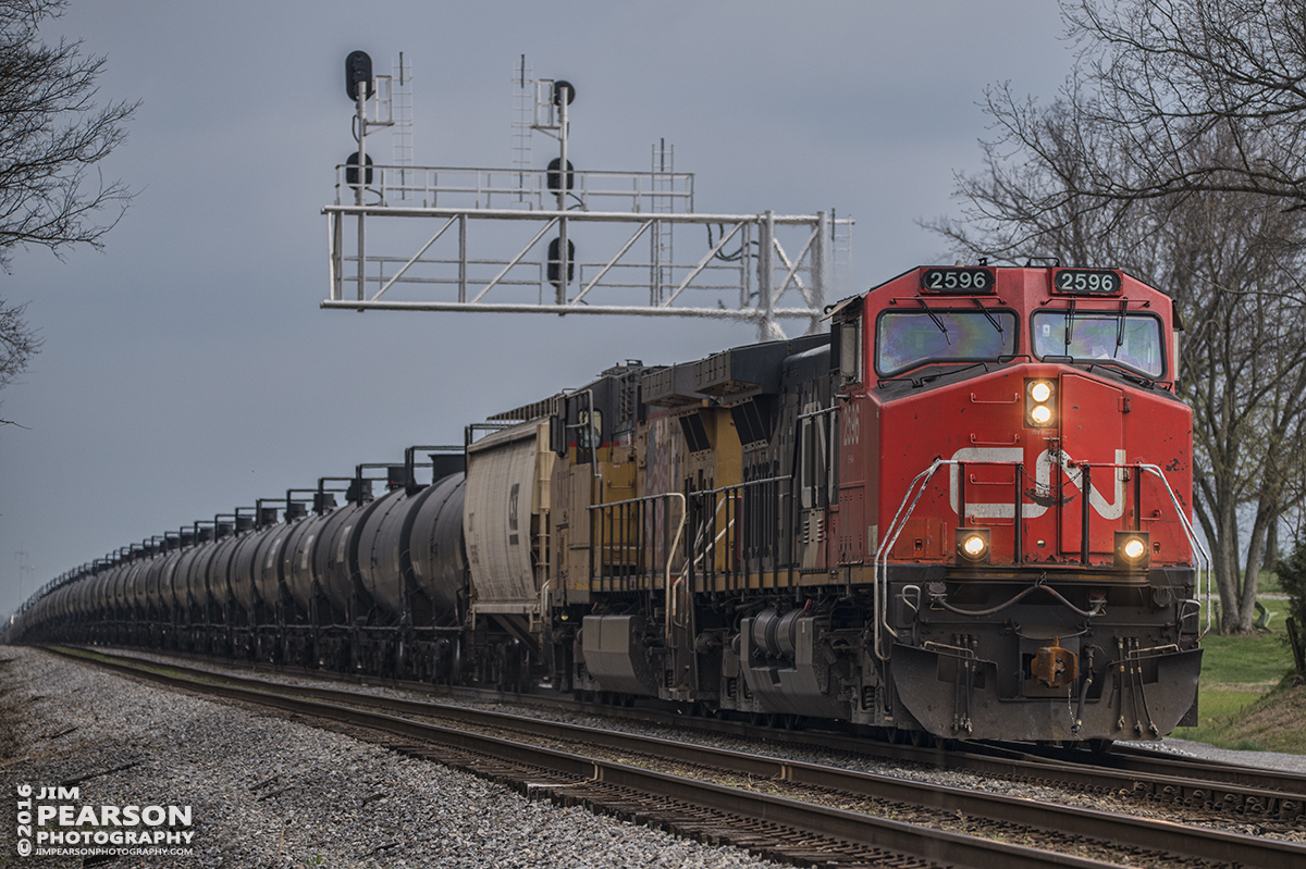 March 19, 2016 - CSX empty ethanol train K444-15 at the north end of Pembroke at Hopkinsville, Ky with CN 2596 leading and UP 5873 trailing as it heads north on the Henderson Subdivision. - Tech Info: 1/1600 | f/5.3 | ISO 250 | Lens: Sigma 150-600 @ 200mm on a Nikon D800 shot and processed in RAW.