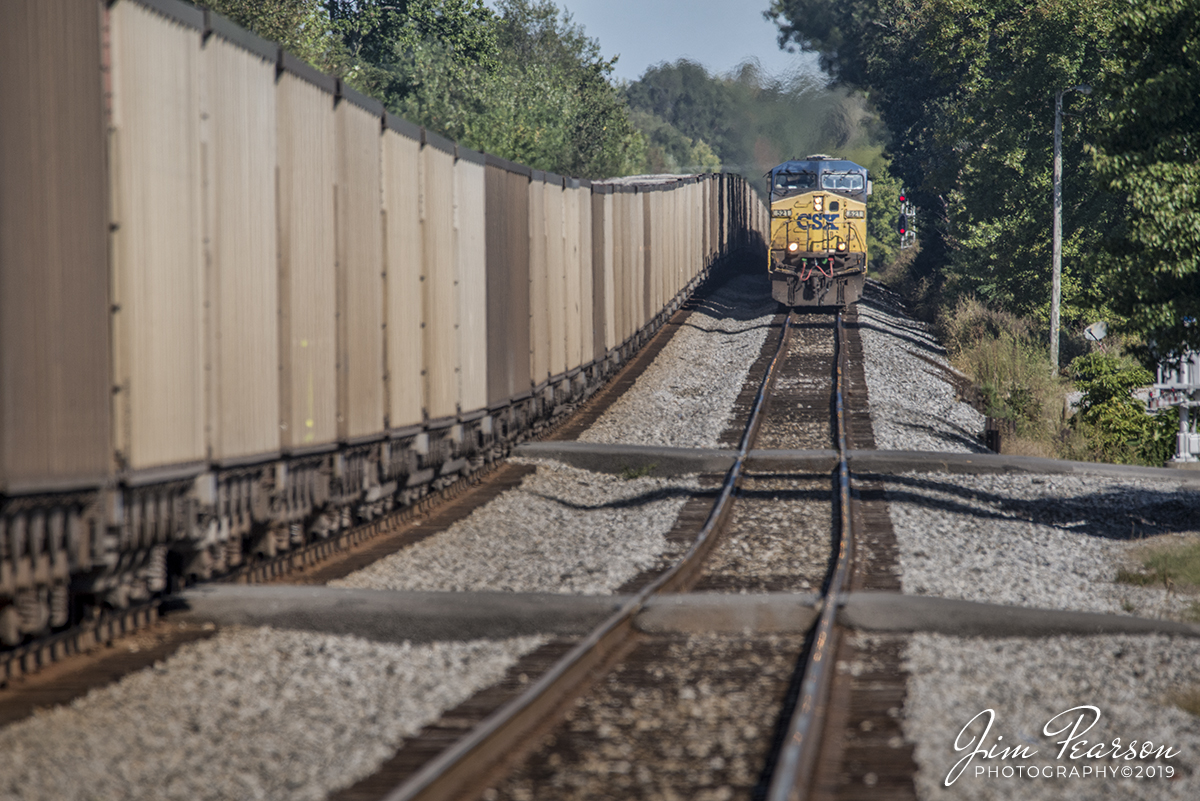 October 8, 2019 - CSX Loaded grain train G307 takes the siding at the north end of Crofton, Kentucky as it passes empty coal train CSX E302 sitting on the main as they both work their way along the Henderson Subdivision.