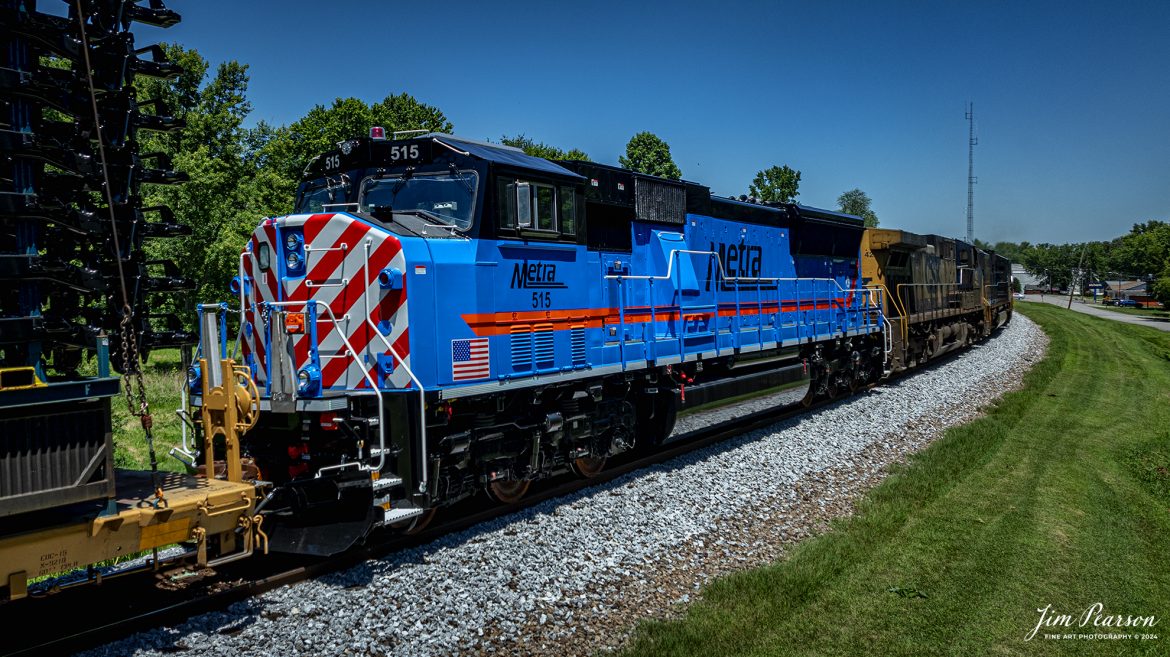 Metra 515 brings up the rear of six units leading CSX M512 as they head north at Mortons Gap, Kentucky on their way north on June 27th, 2024, on the CSX Henderson Subdivision. Right behind the Metra unit is the start of a long string of Toyota Truck frames. 

I’m told that this is the first rebuilt ex-Kansas City unit by the Albertville, Ala.-based Progress Rail Services Corporation for Metra and part of an ongoing program and there are nine more being rebuilt numbered 515-523.

According to Wikipedia: Metra (reporting mark METX) is the primary commuter rail system in the Chicago metropolitan area serving the city of Chicago and its surrounding suburbs via the Union Pacific Railroad, BNSF Railway, and other railroads. The system operates 243 stations on 11 rail lines. It is the fourth busiest commuter rail system in the United States by ridership and the largest and busiest commuter rail system outside the New York City metropolitan area. In 2023, the system had a ridership of 31,894,900, or about 147,800 per weekday as of the first quarter of 2024. The estimated busiest day for Metra ridership occurred on November 4, 2016—the day of the Chicago Cubs 2016 World Series victory rally.

Metra is the descendant of numerous commuter rail services dating to the 1850s. The present system dates to 1974, when the Illinois General Assembly established the Regional Transportation Authority (RTA) to consolidate all public transit operations in the Chicago area, including commuter rail. The RTA's creation was a result of the anticipated failure of commuter service operated and owned by various private railroad companies in the 1970s. In a 1983 reorganization, the RTA placed commuter rail under a newly formed Commuter Rail Division, which branded itself as Metra in 1985. Freight rail companies still operate four of Metra's routes under purchase-of-service agreements. Metra owns all rolling stock and is responsible for all stations along with the respective municipalities. Since its inception, Metra has directed more than $5 billion into the commuter rail system of the Chicago metropolitan area alongside the CTA.

Tech Info: DJI Mavic 3 Classic Drone, RAW, 22mm, f/2.8, 1/1600, ISO 100.

#railroad #railroads #train #trains #bestphoto #railroadengines #picturesoftrains #picturesofrailway #bestphotograph #photographyoftrains #trainphotography #JimPearsonPhotography #trendingphoto #csxt #trainsfromadrone #metra