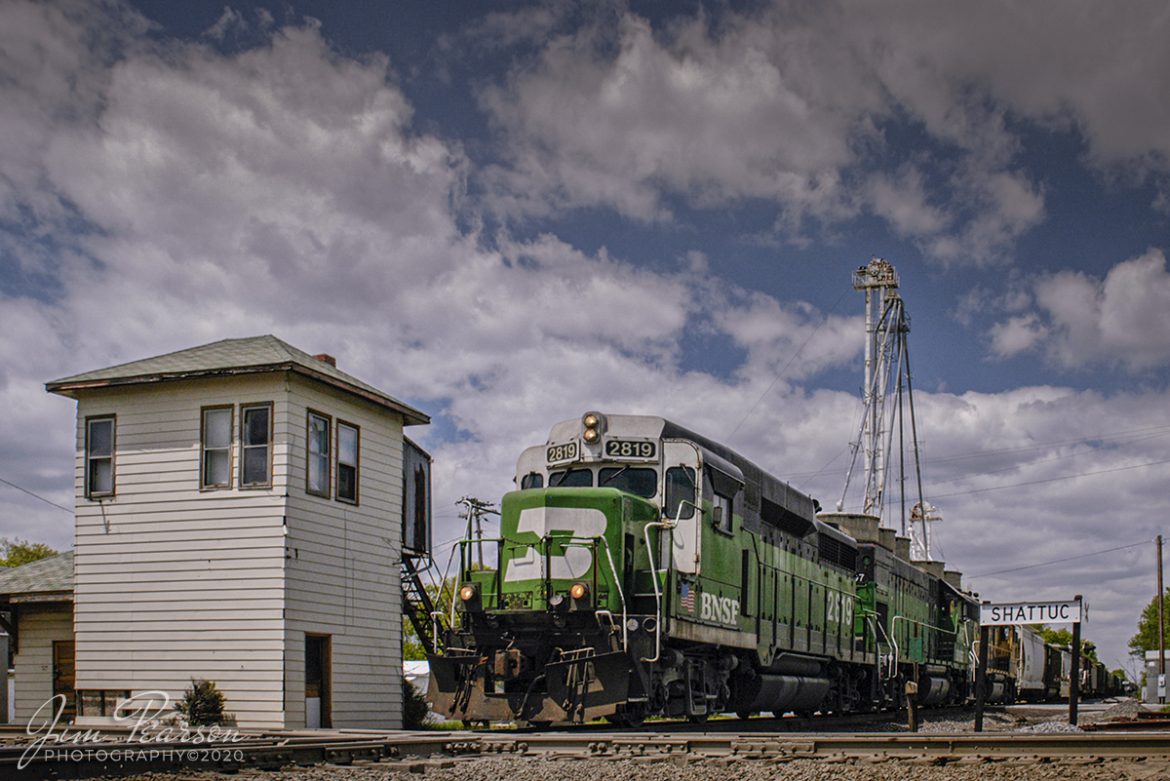 May 1, 2005 - Blast From The Past - BNSF 2819 heads past the old interlocking tower at Shattuc, Illinois on BNSF's Beardstown Subdivision as it crosses over the Illinois Subdivision. 

From what I gather from the web, CSX closed the Illinois Subdivision through here at one point and used it for car storage, but then I find references to the line being used now by The Prairie Line, a shortline out of O'Fallon, IL (I'm now told the shortline hasn't materialized yet). BNSF still owns and uses the Bardstown Sub. I'm also told that the diamond was removed in 2019, at least temporarily. 

In the past this tower controlled the movements of trains on the Chicago, Burlington, and Quincy railroad along with the B&O Railroad. It was closed sometime in the 1980's and from what I can find on the web it was torn down in late 2014. I've also found reports where it was bought by a collector and moved. Whichever is correct, this picture isn't to be replicated again today since the tower is now gone.

If you'd like to read a great piece on the tower, check out this article on The Trackside Photographer by Tom Gatermann, who visited the tower the same year as me.

http://thetracksidephotographer.com/tag/shattuc-tower/

Photograph the towers when and where you can as they continue to disappear from the railroad landscape.

Tech Info: Nikon D100, Sigma 24-70mm @ 24mm, f/8, 1/800, ISO 400.

#railroad #railroads #train #trains #bestphoto #railroadengines #picturesoftrains #picturesofrailway #bestphotograph #photographyoftrains #trainphotography #JimPearsonPhotography #trendingphoto