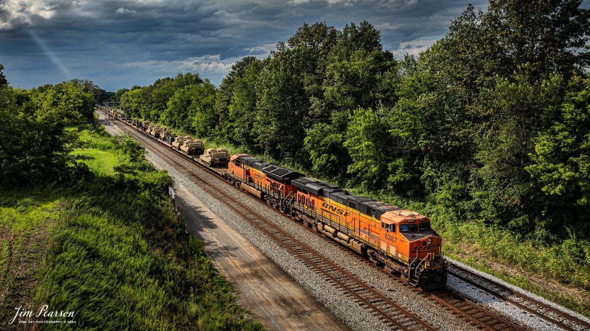 BNSF 6387 and 3947 lead CSX S577 as the crew backs a loaded military train onto the Ft. Campbell lead at from Casky yard at Hopkinsville, Ky, on the CSX Henderson Subdivision on July 9th, 2024.

Tech Info: DJI Mavic 3 Classic Drone, RAW, 22mm, f/2.8, 1/2500, ISO 160.

#railroad #railroads #train #trains #bestphoto #railroadengines #picturesoftrains #picturesofrailway #bestphotograph #photographyoftrains #trainphotography #JimPearsonPhotography #trendingphoto #militarytrains #stormyweather