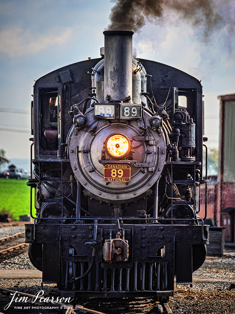 Canadian National 89 idles outside the engine house at the Strasburg Railroad as It prepares to pull the first train of the day on October 7th, 2024 from Strasburg, PA.

According to Wikipedia: The Strasburg Rail Road (reporting mark SRC) is a heritage railroad and the oldest continuously operating standard-gauge railroad in the western hemisphere, as well as the oldest public utility in the Commonwealth of Pennsylvania. Chartered in 1832, the Strasburg Rail Road Company is today a heritage railroad offering excursion trains hauled by steam locomotives on 4.02 mi of track in Pennsylvania Dutch Country, as well as providing contract railroad mechanical services, and freight service to area shippers. The railroad's headquarters are outside Strasburg, Pennsylvania.

Tech Info: Nikon D810, RAW, Nikon 70-300 @ 300mm, f/5.6, 1/1600, ISO 640.

#railroad #railroads #train, #trains #railway #railway #steamtrains #railtransport #railroadengines #picturesoftrains #picturesofrailways #besttrainphotograph #bestphoto #photographyoftrains #bestsoldpicture #JimPearsonPhotography #StrasburgRailroad