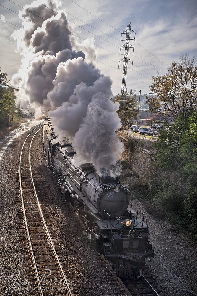 November 13, 2019 - Union Pacific's 4014 Big Boy pulls it's train north out of Union Station at Little Rock, Arkansas on a cold fall afternoon. 

Union Pacific has billed this move as The Great Race Across the Southwest as the train is making a circle around the southwest over a six week or so period hitting Arkansas, Arizona, California, Colorado, Kansas, Missouri, Nevada, New Mexico, Oklahoma, Texas, Utah and Wyoming.

According to Wikipedia: Union Pacific 4014 is a four-cylinder simple articulated 4-8-8-4 Big Boy-type steam locomotive owned and operated by the Union Pacific Railroad. Built in 1941 by the American Locomotive Company (ALCO) of Schenectady, New York, No. 4014 is the only operating Big Boy of the eight that remain in existence.

The locomotive operated in revenue service until 1959. It was donated to the Railway and Locomotive Historical Society in late 1961 and thereafter displayed in Fairplex in Pomona, California. In 2013, Union Pacific re-acquired the locomotive and launched a restoration project at their Steam Shop in Cheyenne, Wyoming.[citation needed] In 2019, No. 4014 was operated for the first time after it sat dormant for almost six decades. Part of Union Pacific's heritage fleet, it now operates in excursion service, in addition to hauling revenue freight during ferry moves.

Tech Info: Fuji XT1, Nikon 18mm, 1/350sec, f/7.1, ISO 200.

#fuji #UP4014 #UPSteam #unionpacificbigboy #bigboy #unionpacificrailroad