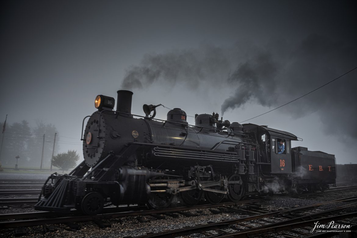 East Broad Top (EBT) steam locomotive #16 pulls  through the yard in the early morning fog as the fireman keeps an eye on the track ahead, at Rockhill Furnace, Pennsylvania on October 6th, 2024, during the museum’s Friends of the East Broad top event.

According to the East Broad Top Website: Locomotive #16 was built in 1916 by the Baldwin Locomotive Works.

Entering the age of modern steam in 1916, the EBT received its first of three large Mikados. Unlike the previous three smaller locomotives, #16 came with superheaters, piston valves, and Southern valve gear. One story mentions #16 pulled 60 empty hoppers from Mt. Union to Rockhill in one train, literally clearing out the yard. #16 underwent an overhaul in 1955 and made only a handful of trips in early 1956 before the railroad shut down. On February 1, 2023, the locomotive returned to service.

Tech Info: Nikon D810, RAW, Nikon 24-70 @24mm, f/2.8, 1/50, ISO 110.

steam locomotive, train, railways, vintage, smoke, green hillside, sunlight, iron bridge, transportation, travel, photography of trains, train photography, Jim Pearson Photography, trending photo, East Broad Top Railroad, steam train