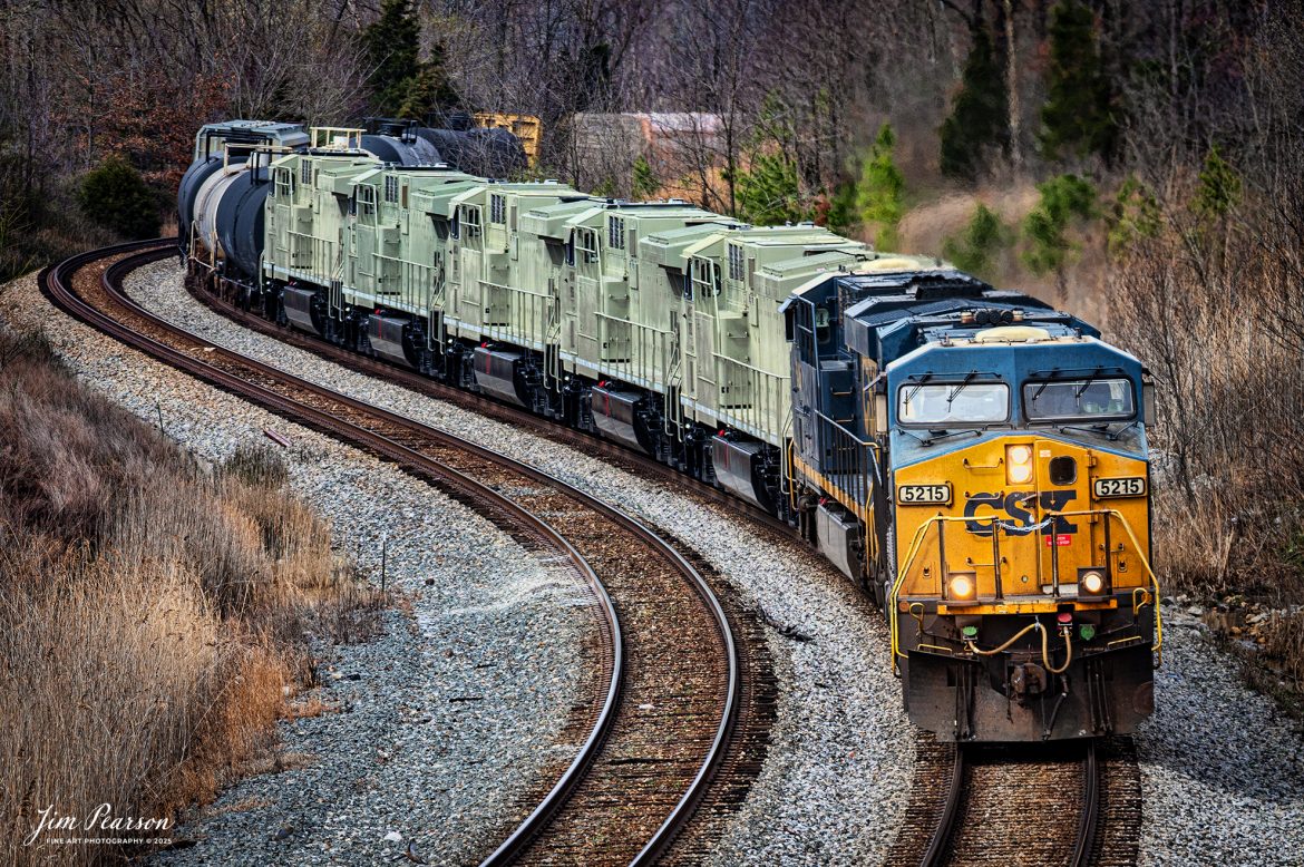 CSX M813 heads south through the S Curve at Nortonville, Kentucky, with engines FEX 4937, 4936, 4934, 4939, 4938 in tow on the CSX Henderson Subdivision on March 16th, 2025. The locomotives in tow are bound for the Ferromex Railroad.

Ferromex (reporting mark FXE) (syllabic abbreviation of Ferrocarril Mexicano, 'Mexican Railway') is a private rail consortium that operates the largest (by mileage) railway in Mexico with combined mileage (Ferromex + Ferrosur) of 12,100 kilometres (7,500 mi) and is often classed with North American Class I railroads.

Ferromex began operating on February 19, 1998, following the privatization of most of the government-owned railways by Mexican President Ernesto Zedillo Ponce de León. Ferromex operates more than 9,610 kilometers (5,970 mi) of track and interconnects five major inland Mexican cities, five cities along the border with the United States, four seaports on the Pacific Ocean, and one more on the Gulf of Mexico. Grupo México owns 74% and Union Pacific Corporation owns 26% of the company. The Ferromex system operates 9,610 km of Ferromex tracks plus 2,654 kilometers (1,649 mi) of Ferrosur tracks.

Tech Info: Nikon Z6ii Mirrorless Camera, RAW, Sigma 150-600 @170mm, f/5, 1/1000, ISO 400.

#railroad #railroads #train, #trains #railway #railway #railtransport #railroadengines #picturesoftrains #picturesofrailways #besttrainphotograph #bestphoto #photographyoftrains #bestsoldpicture #JimPearsonPhotography #trainsfromadrone #csxhendersonsubdivision #onecsx #Ferromex