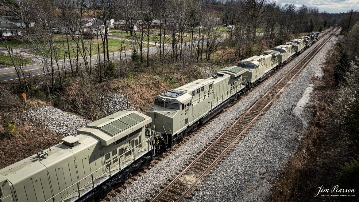 CSX M813 heads south at Nortonville, Kentucky, with engines FEX 4937, 4936, 4934, 4939, 4938 in tow on the CSX Henderson Subdivision on March 16th, 2025. The locomotives in tow were FEX 4937, 4936, 4934, 4939, 4938 and they’re bound for the Ferromex Railroad.

Ferromex (reporting mark FXE) (syllabic abbreviation of Ferrocarril Mexicano, 'Mexican Railway') is a private rail consortium that operates the largest (by mileage) railway in Mexico with combined mileage (Ferromex + Ferrosur) of 12,100 kilometres (7,500 mi) and is often classed with North American Class I railroads.

Ferromex began operating on February 19, 1998, following the privatization of most of the government-owned railways by Mexican President Ernesto Zedillo Ponce de León. Ferromex operates more than 9,610 kilometers (5,970 mi) of track and interconnects five major inland Mexican cities, five cities along the border with the United States, four seaports on the Pacific Ocean, and one more on the Gulf of Mexico. Grupo México owns 74% and Union Pacific Corporation owns 26% of the company. The Ferromex system operates 9,610 km of Ferromex tracks plus 2,654 kilometers (1,649 mi) of Ferrosur tracks.

Tech Info: DJI Mavic 3 Classic Drone, RAW, 22mm, f/2.8, 1/2000, ISO 130.

#railroad #railroads #train, #trains #railway #railway #railtransport #railroadengines #picturesoftrains #picturesofrailways #besttrainphotograph #bestphoto #photographyoftrains #bestsoldpicture #JimPearsonPhotography #trainsfromadrone #csxhendersonsubdivision #onecsx #Ferromex