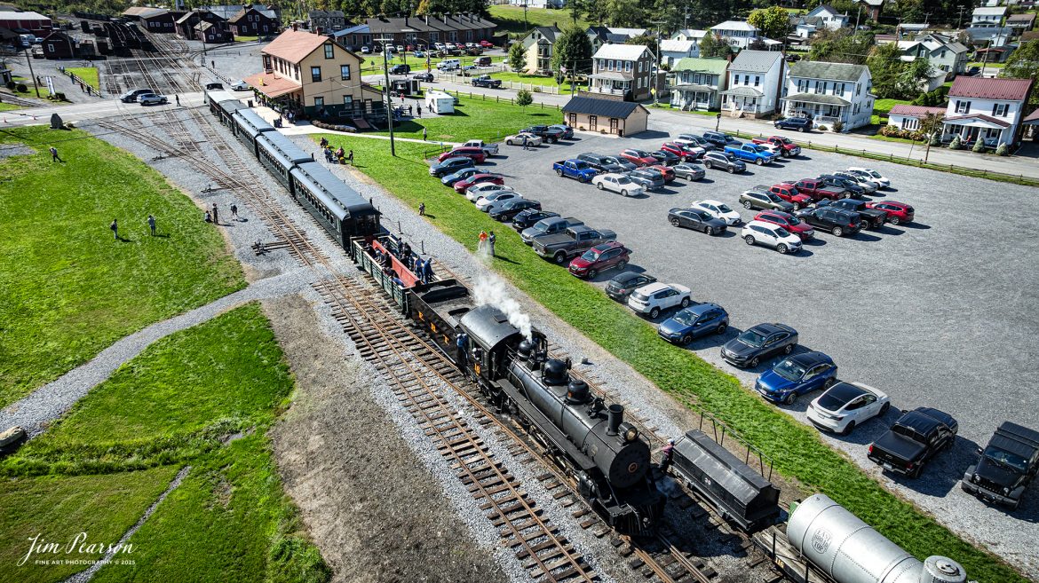 East Broad Top (EBT) steam locomotive 16 leads a passenger train as they wait to depart from the depot at Rockhill Furnace, Pennsylvania, on October 6th, 2024.

According to the East Broad Top Website: Locomotive #16 was built in 1916 by the Baldwin Locomotive Works.

Entering the age of modern steam in 1916, the EBT received its first of three large Mikados. Unlike the previous three smaller locomotives, #16 came with superheaters, piston valves, and Southern valve gear. One story mentions #16 pulled 60 empty hoppers from Mt. Union to Rockhill in one train, literally clearing out the yard. #16 underwent an overhaul in 1955 and made only a handful of trips in early 1956 before the railroad shut down an overhaul when the EBT shut down. On February 1, 2023, the locomotive returned to service.

Tech Info: DJI Mavic 3 Classic Drone, RAW, 24mm, f/2.8, 1/1250, ISO 110.

#steamtrains #JimPearsonPhotography #trainsfromtheair #EastBroadTop