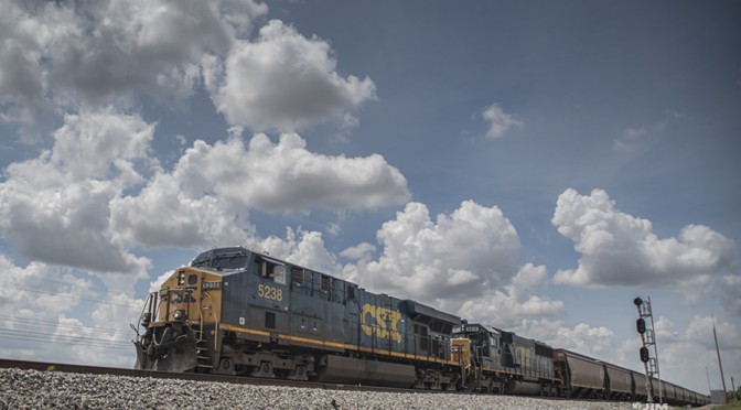 May 28, 2015 - The conductor on CSX's Q647 gives a wave as his train passes through the north end of the siding at Robards, Ky as they head south on the Henderson Subdivision with 5238 in the lead.