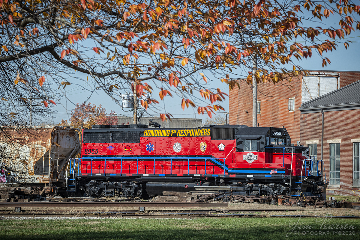 Port Harbor Railroad Honors 1st Responders

A last bit of fall clings to the trees still on November 7th, 2020, as Port Harbor Railroad Corporation's (reporting mark PHRR) Honoring 1st Responders locomotive 8955 sits tied down at Granite City, Illinois at America's Central Port America's Central Port.

According to Wikipedia: The Port Harbor Railroad is a short-line railroad in Granite City, Illinois, serving an industrial port district known as America's Central Port.

PHRR began operations in 2004 as a subsidiary of the Respondek Railroad and connects with the Terminal Railroad Association of St. Louis at "WR Tower," a major railroad junction in Granite City. PHRR transports everything from steel and aluminum products to foods, lumber, paper, chemicals, minerals, grains and other products. The railroad is classified as a Class III Common Carrier.

Tech Info: Nikon D800, RAW, Sigma 150-600 @150mm, f/16, 1/400, ISO 650.