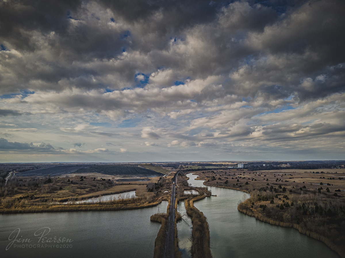 Paducah & Louisville PRX1 departs Warrior Coal, Nebo, Ky

The late afternoon light plays across the marshland as Paducah and Louisville 4504 and 4501 begin to pull their freshly loaded coal train away from the Warrior Coal Mine loop from Nebo, Kentucky on  December 5th, 2020 as they head south to Calvert City Terminal at Calvert City, Ky.

Tech Info: DJI Mavic Air 2 Drone, JPG, 4.5mm (24mm equivalent lens) f/2.8, 1/640, ISO 100.