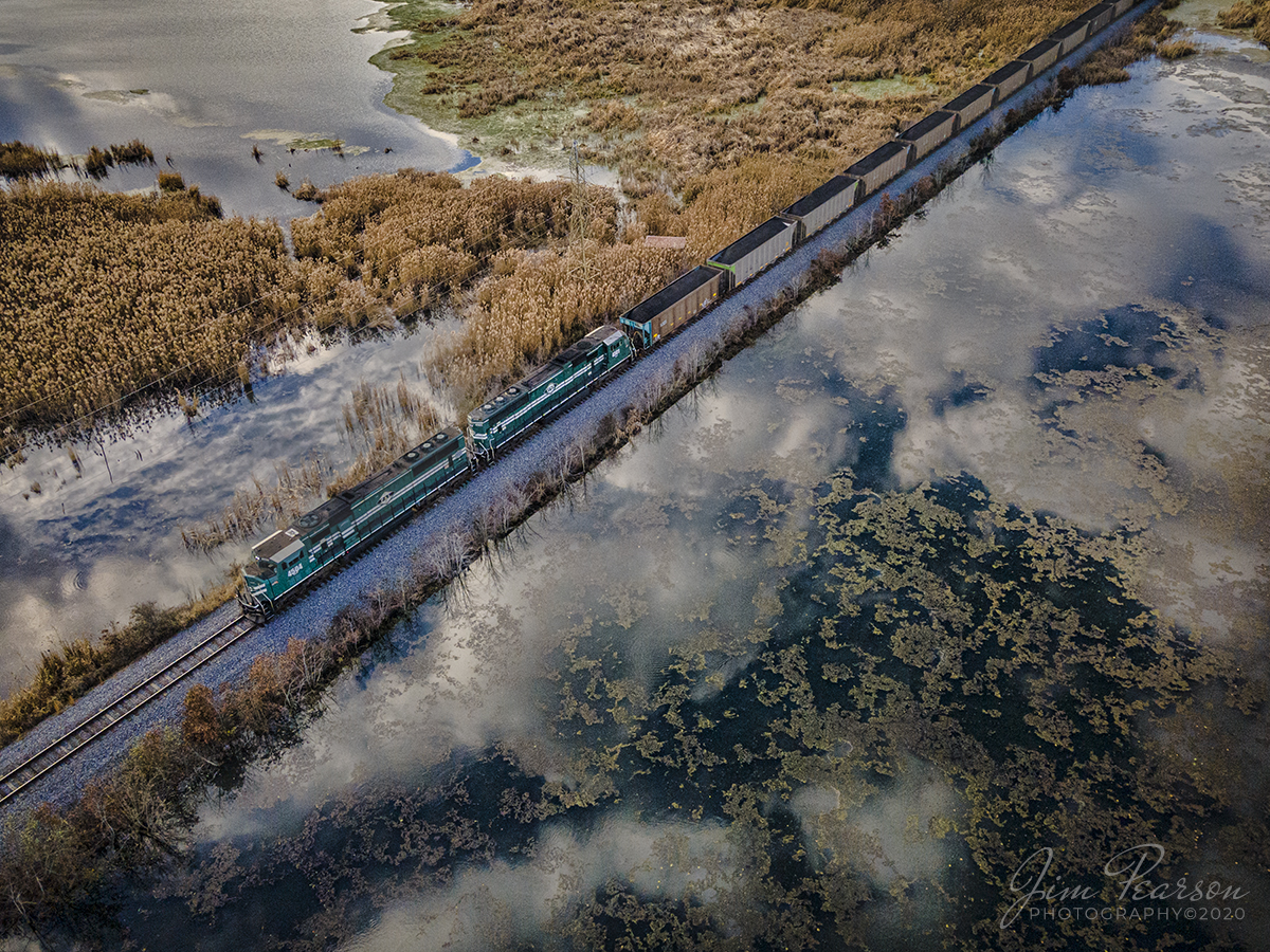 Paducah & Louisville PRX1 NB through the clouds at Nebo, Ky

Calm winds prevailed for me as PRX1 makes its way through the  the marshlands as Paducah and Louisville 4504 and 4501 pull their freshly loaded coal train away from the Warrior Coal Mine loop from Nebo, Kentucky on December 5th, 2020 providing wonderful reflections!

Tech Info: DJI Mavic Air 2 Drone, JPG, 4.5mm (24mm equivalent lens) f/2.8, 1/500, ISO 100, Exp. Comp -3 (for detail in the highlights).