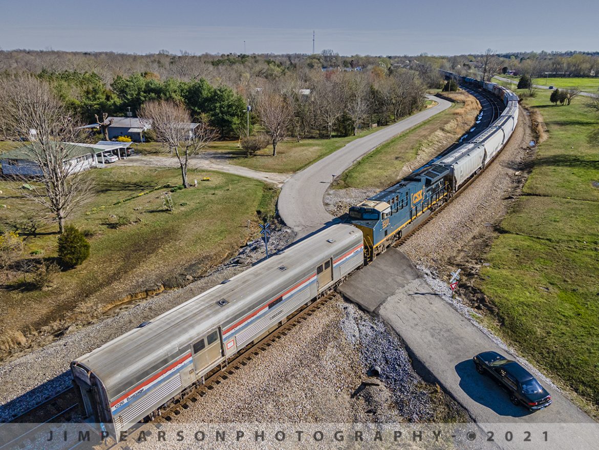 CSX Q513-26 with two interesting moves

Its not very often that I catch a train that has two interesting moves at the same time, but March 26th, 2021 was one of those days when I caught CSX Q513 heading south on the Henderson Subdivision!

Up front behind the first engine was a GMTX 192 switcher (ex-Kansas City Southern Unit) passing through Mortons Junction at Mortons Gap, Ky, which Im told is headed for St. Marys Railroad Company, located in St. Marys, Georgia.

On the rear of the train was Mid-America Railcar Leasing (MRLX) 1226, which appears to be an ex-Amtrak baggage car that I'm also told is headed for the Georgia coastal railway at St. Marys, Georgia. Im also told that it will be converted to a gift shop for their excursion trains. Here its passing through the crossing at the north end of the siding at Kelly, Ky, behind the DPU on the rear of the train as they head south on the Henderson Subdivision.

St. Marys Railroad (reporting marks SM) is a standard gauge, Class III, common carrier railroad based out of St. Marys, Georgia. Interchange is made with the First Coast Railroad in Kingsland, Georgia and gives customers easy access to Jacksonville, Florida railroads CSX Transportation, Norfolk Southern Railway and Florida East Coast Railway.

Mid America Railcar Leasing is a limited liability company that leases private passenger railroad cars, most of which can be pulled on the end of Amtrak trains.

#trainphotography #railroadphotography #trains #railways #dronephotography #jimpearsonphotography 

Tech Info: DJI Mavic Air 2 Drone, RAW, 4.5mm (24mm equivalent lens) f/2.8, 1/800 & 1/1250, ISO 100.