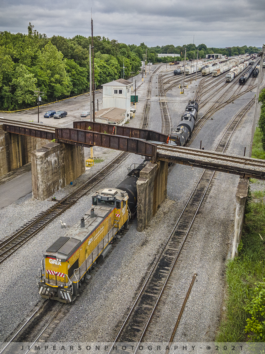 Paducah and Louisville Railway yard work at Paducah, Ky

Switcher GMTX 397 backs a string of tank cars under the flyover for the CN at the Paducah and Louisville Railway (PAL) yard at Paducah, Kentucky on June 8th, 2021 as a PAL yard crew works on building trains on a stormy afternoon.

According to Wikipedia: The Paducah & Louisville Railway is a Class II railroad that operates freight service between Paducah and Louisville, Kentucky. The line is located entirely within the Commonwealth of Kentucky. The 270-mile line was purchased from Illinois Central Gulf Railroad in August 1986.

The 223-mile (359 km) main route runs between Paducah and Louisville with branch lines from Paducah to Kevil and Mayfield, Kentucky, and another from Cecilia to Elizabethtown, Kentucky. The PAL interchanges with Burlington Northern Santa Fe (BNSF) and Canadian National (CN), formerly Illinois Central Railroad, in Paducah. In Madisonville, the line interchanges with CSX Transportation (CSXT).

Tech Info: DJI Mavic Air 2 Drone, RAW, 4.5mm (24mm equivalent lens) f/2.8, 1/500, ISO 100.