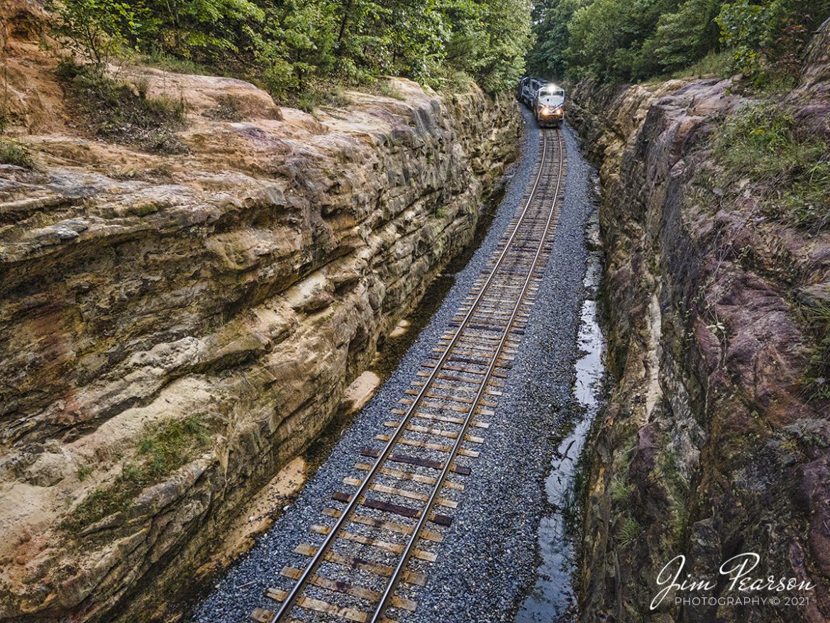 I spent the afternoon of August 17th, 2021, chasing the Paducah and Louisville Railway LG1 loaded coal train from Madisonville to Eastview, Kentucky. The latter was my goal for this chase as hadnt photographed the cut at Eastview before and it has been on my list for a while.

I got to the location about 10 minutes before the train and checked out the scene with my Nikon first as the cut is right up against the bridge on Meeting Creek Road and I wasnt sure I wanted or even needed to use the drone at this location. After consideration I decided to launch the drone as I felt it could give me the best platform for a shot that would offer the best perspective that was different from other photos Ive seen taken from here.

With the drone in place, it was a short wait as I captured Paducah and Louisville University of Kentucky locomotives 4522 and 2012 lead the Louisville Gas & Electric loaded coal train as it started its way north through the cut at Eastview, Kentucky.

Tech Info: Wide Photo: DJI Mavic Air 2 Drone, RAW, 4.5mm (24mm equivalent lens) f/2.8, 1/500, ISO 100. 

#trainphotography #railroadphotography #trains #railways #dronephotography #trainphotographer #railroadphotographer #jimpearsonphotography