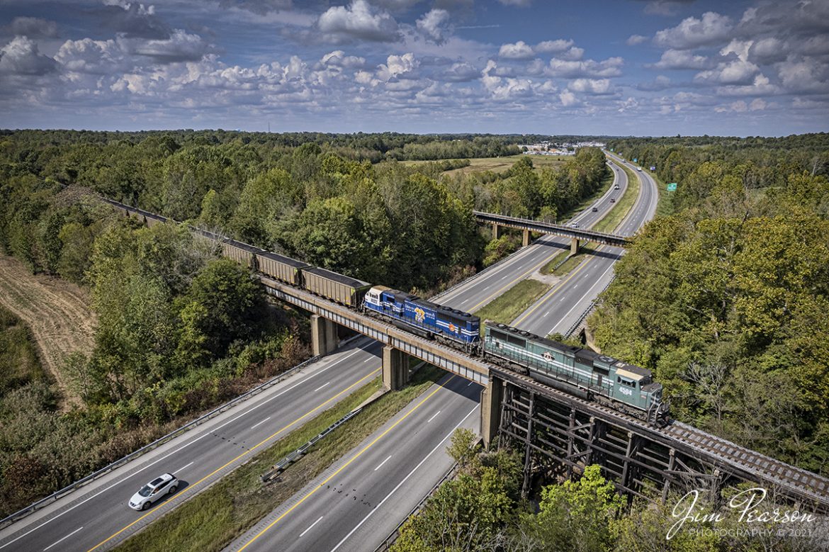 Paducah and Louisville 4504 and 4522 (UK paint scheme) roll across Interstate 69 at Madisonville, Kentucky as they head north with their loaded coal train, bound for the Louisville Gas and Electric power plant in the Kosmosdale neighborhood of Louisville, Kentucky on October 5th, 2021.

Tech Info: DJI Mavic Air 2S Drone, RAW, 22mm, f/2.8, 1/2000, ISO 120.

#trainphotography #railroadphotography #trains #railways #dronephotography #trainphotographer #railroadphotographer #jimpearsonphotography