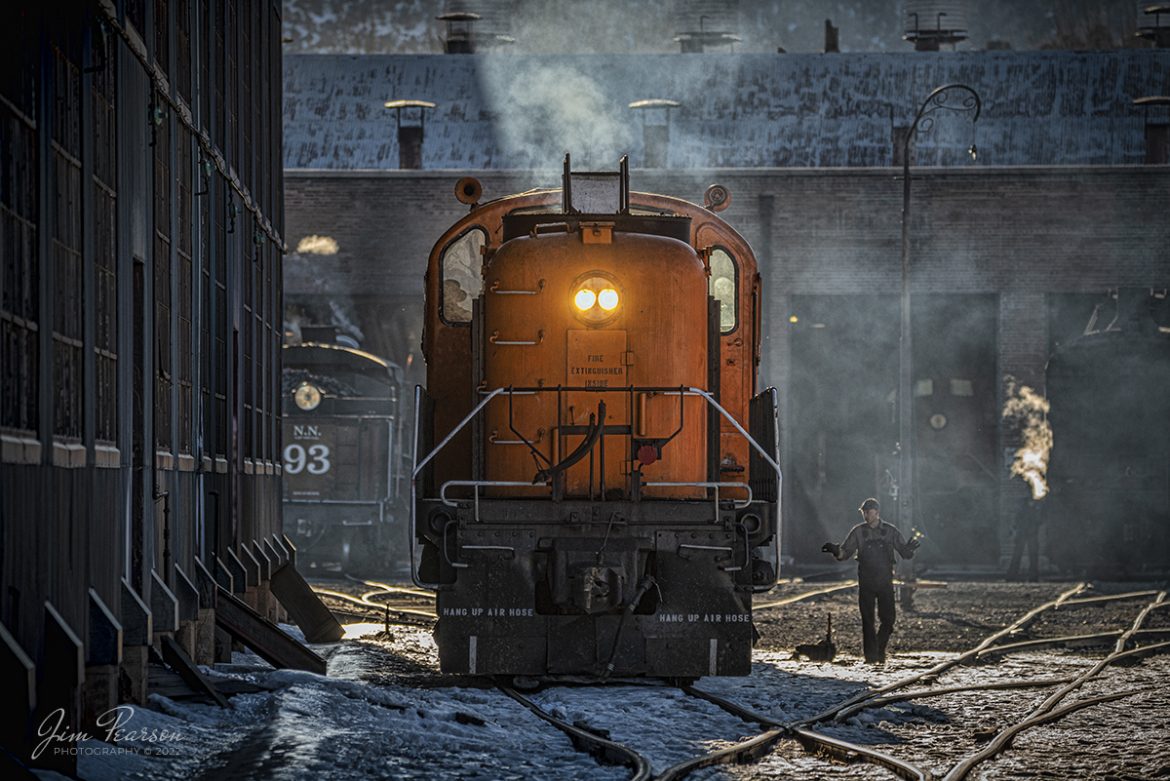 Nevada Northern Railway brakeman Nick Scheresky signals to the engineer on locomotive 109 to go ahead and clear the switch, as they head back toward the engine house at Ely, Nevada on February 11th, 2022. 

Locomotive #109 Alco RS-3 built in 1950, 78426, 1800 (1200) hp, 1370 produced. It was bought new by Kennecott in November of 1950 for EX-Ray Mines but was never delivered to them. It was sent to Kennecott Copper Corp and was later sold to LA Department of Water and Power and now is in service at the Nevada Northern.

According to Wikipedia: The Nevada Northern Railway Museum is a railroad museum and heritage railroad located in Ely, Nevada and operated by a historic foundation dedicated to the preservation of the Nevada Northern Railway.

Tech Info: Nikon D800, RAW, Sigma 150-600 @ 280mm, f/5.6, 1/800, ISO 360.

#trainphotography #railroadphotography #trains #railways #jimpearsonphotography #trainphotographer #railroadphotographer #steamtrains #nevadanorthernrailway