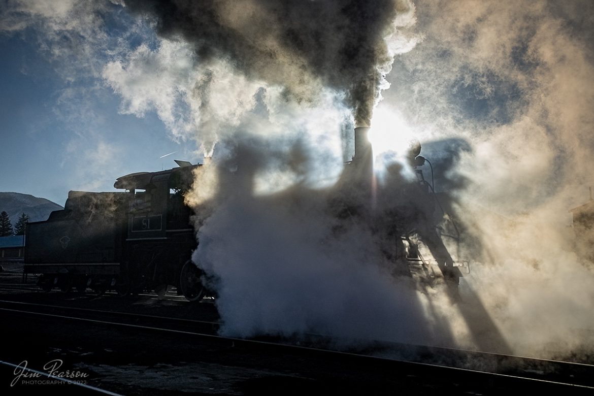 The frigid early morning air and backlight sunlight makes for a dramatic photo of Nevada Northern Railway engine 81 as it backs out of the engine house under the control of engineer Jim Montague and fireman, Dale Olson, as they get equipment ready for another day at Ely, Nevada on February 13th, 2022. 

Nevada Northern No. 81 is a "Consolidation" type (2-8-0) steam locomotive that was built for the Nevada Northern in 1917 by the Baldwin Locomotive Works in Philadelphia, PA, at a cost of $23,700. It was built for Mixed service to haul both freight and passenger trains on the Nevada Northern railway.

According to Wikipedia: The Nevada Northern Railway Museum is a railroad museum and heritage railroad located in Ely, Nevada and operated by a historic foundation dedicated to the preservation of the Nevada Northern Railway.

Tech Info: Nikon D800, RAW, Nikon 10-24mm @ 24mm, f/4.5, 1/8000, ISO 450.

#trainphotography #railroadphotography #trains #railways #jimpearsonphotography #trainphotographer #railroadphotographer #steamtrains #nevadanorthernrailway