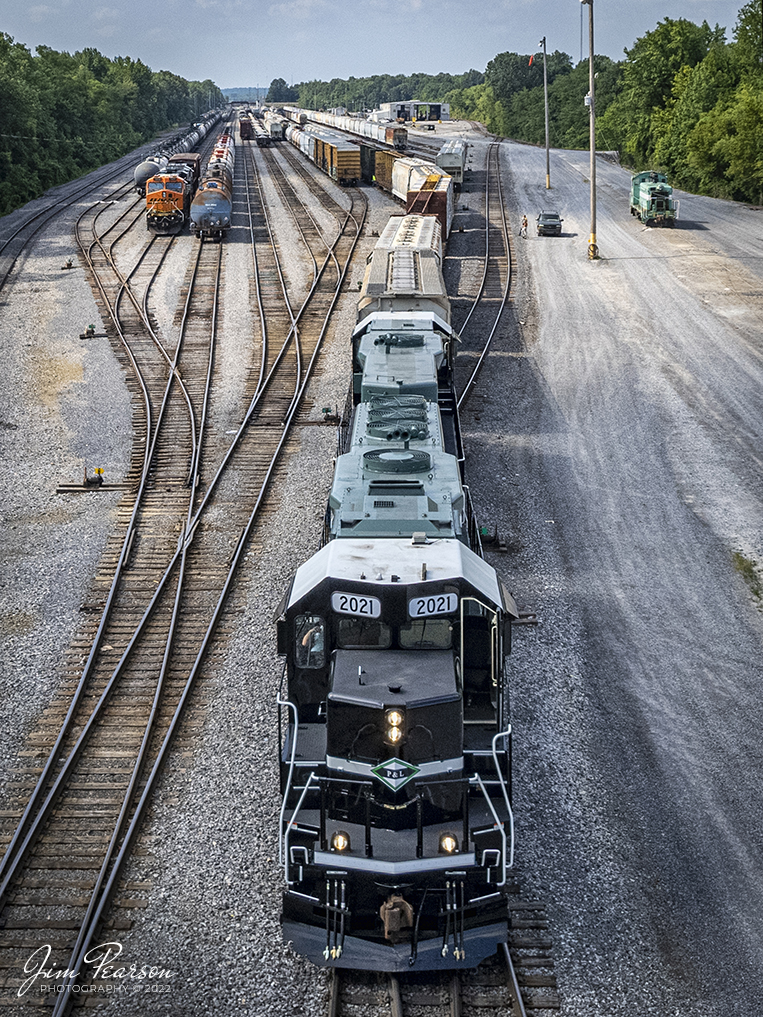 Paducah and Louisville Railways' (PAL) newly painted 35th Anniversary engines 2021 and 1986, work in the north end of the yard on July 8th, 2022, at Paducah, Kentucky. 

According to Wikipedia: The Paducah & Louisville Railway is a Class II railroad that operates freight service between Paducah and Louisville, Kentucky. The line is located entirely within the Commonwealth of Kentucky. The 270-mile line was purchased from Illinois Central Gulf Railroad in August 1986.

Flown and access with permission from the Paducah and Louisville Railway.

Tech Info: DJI Mavic Air 2S Drone, RAW, 22mm, f/2.8, 1/2500, ISO 130.

#trainphotography #railroadphotography #trains #railways #dronephotography #trainphotographer #railroadphotographer #jimpearsonphotography