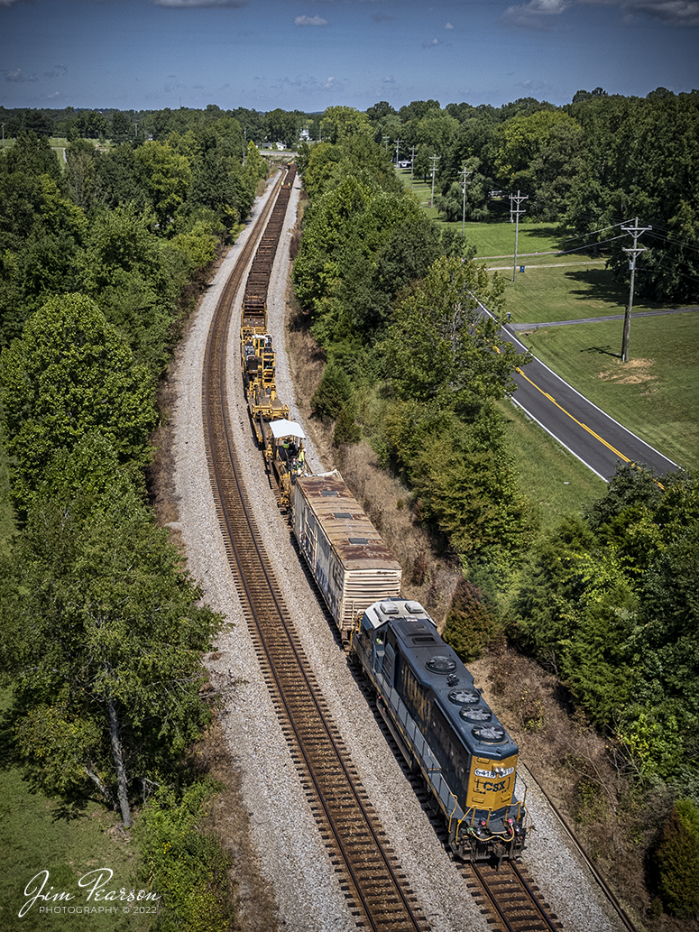 Running long hood forward, CSXT 6418 leads CSX rail train W872 as they work on picking up ribbon rail along the Henderson Subdivision right-of-way at Nortonville, Kentucky on August 30th, 2022.

Tech Info: DJI Mavic Air 2 Drone, RAW, 4.5mm (24mm equivalent lens) f/2.8, 1/1600, ISO 110.

#trainphotography #railroadphotography #trains #railways #dronephotography #trainphotographer #railroadphotographer #jimpearsonphotography