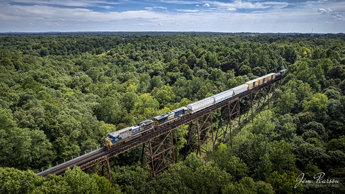 CSXT 523 and 5283 lead local L391 north as they pass over Gum Lick, the highest and longest trestle on the CSX Henderson Subdivision, on their way to perform work at Atkinson Yard in Madisonville, Kentucky on September 2nd, 2022.

Gum Lick trestle is located between Kelly and Crofton, Ky and not only the longest trestle on the subdivision but also the highest on the old Louisville and Nashville Railway line, now known as the Henderson Subdivision.

Tech Info: DJI Mavic Air 2S Drone, RAW, 22mm, f/2.8, 1/1600, ISO 100.

#trainphotography #railroadphotography #trains #railways #dronephotography #trainphotographer #railroadphotographer #jimpearsonphotography