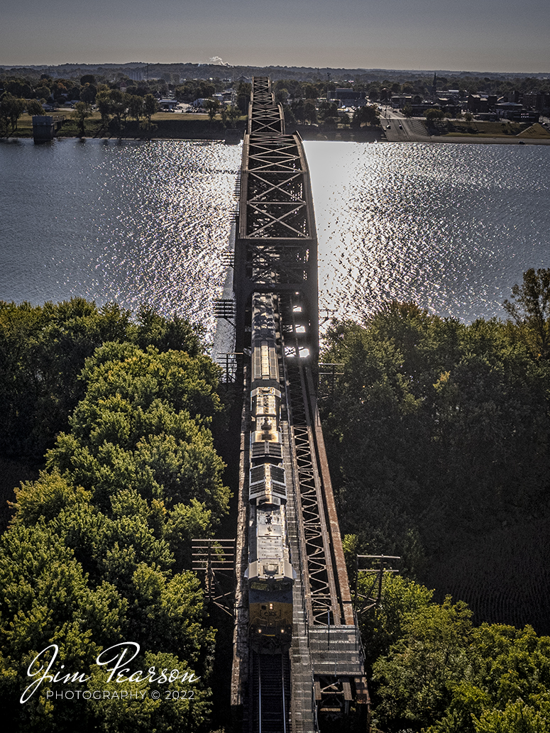 Running away from the rising sun, CSXT 3411 heads up M500 as they make their way across the Ohio River from Henderson, Kentucky on October 14th, 2022, heading north on the Henderson Subdivision toward Evansville, IN.

Tech Info: DJI Mavic Air 2S Drone, 22mm, f/2.8, 1/4000, ISO 110.

#trainphotography #railroadphotography #trains #railways #dronephotography #trainphotographer #railroadphotographer #jimpearsonphotography #csxhendersonsubdivision #csxt