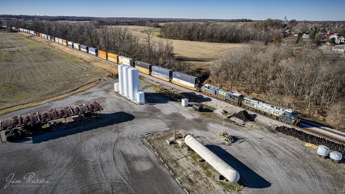 I was really doubtful Id catch CSXT 1776, Honoring our Veterans Unit, as it led CSX I028 out of Hopkinsville, KY, as I didn't get notice it was coming until I finally got out of bed and that was 45 minutes after I got the message. It was passing through Hopkinsville, KY and I live about 30 minutes from there, so I figured I had missed it as they don't usually let Intermodal sit around for very long.

Well, I was sitting here in my home office working on pictures, responding to comments and listening to the scanner when I heard I028 was coming into Madisonville, KY and it was about an hour after it left Hopkinsville, Ky! I decided to head out and see if I could catch it somewhere north of Madisonville. 

I threw up a little prayer for some help on catching it (yes, I do that) and I heard the dispatcher tell them that they would be taking the siding at Slaughters, Kentucky to wait on three, yes three southbounds!

This is one of the photos I captured of CSXT 1776, Honoring our Veterans Unit, as it waits in the siding at the north end of Slaughters, Kentucky, for the three southbound trains to pass on the Henderson Subdivision on November 30th, 2022.

I found out they were doing major track work at the south end of the siding at Breton, Kentucky, which is about 7 miles north of Slaughters and trains through there were restricted to 10mph, which caused a major bottleneck. They waited at Slaughters in the siding for about an hour for B795, M513 and hot intermodal I025 to pass before he got his turn to head north. There were also about 4 other trains behind I028 waiting to move as well! Quite a bottleneck for the railroad, turned out to be a haven for photos and videos for future posts!

Tech Info: DJI Mavic Air 2 Drone, RAW, 4.5mm (24mm equivalent lens) f/2.8, 1/2000, ISO 200.

#trainphotography #railroadphotography #trains #railways #dronephotography #trainphotographer #railroadphotographer #jimpearsonphotography #indianarailroads #trainsfromtheair