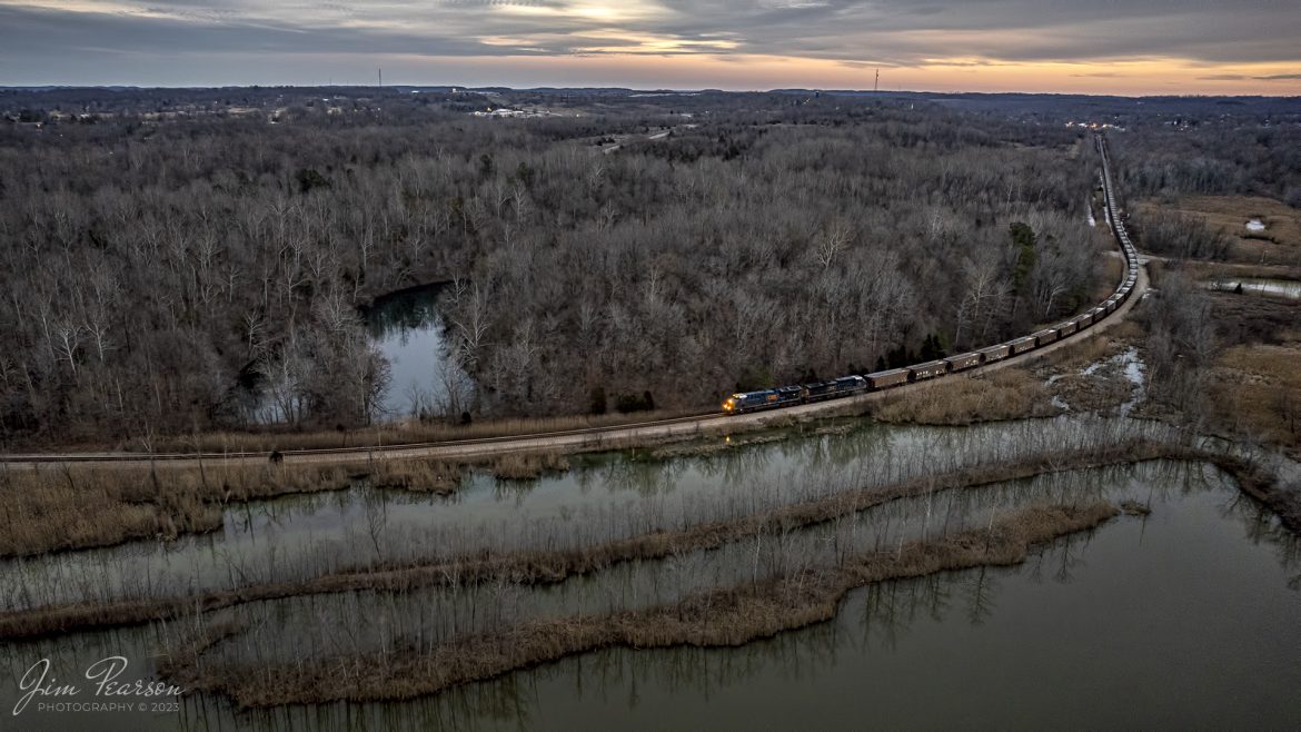 CSX E319 rolls through the countryside out of Earlington, Kentucky at dusk as they head north on the CSX Henderson Subdivision on February 18th, 2023, to Evansville, Indiana.

Tech Info: DJI Mavic Air 2S Drone, RAW, 22mm, f/2.8, 1/100, ISO 800, -.7 stop.

#trainphotography #railroadphotography #trains #railways #dronephotography #trainphotographer #railroadphotographer #jimpearsonphotography #kentuckytrains #csx #csxrailroad