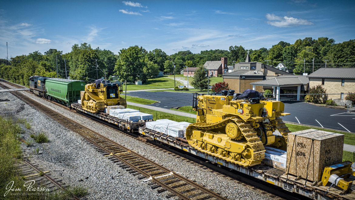 CSX M513 passes through downtown Hanson, KY,  with two brand new large Caterpillar D11 Dozers at the front of their train, as it heads south on the Henderson Subdivision on July 31st, 2023.

Tech Info: DJI Mavic 3 Classic Drone, RAW, 24mm, f/2.8, 1/2000, ISO 120.

#trainphotography #railroadphotography #trains #railways #dronephotography #trainphotographer #railroadphotographer #jimpearsonphotography #trains #csxt #mavic3classic #drones #trainsfromtheair #trainsfromadrone