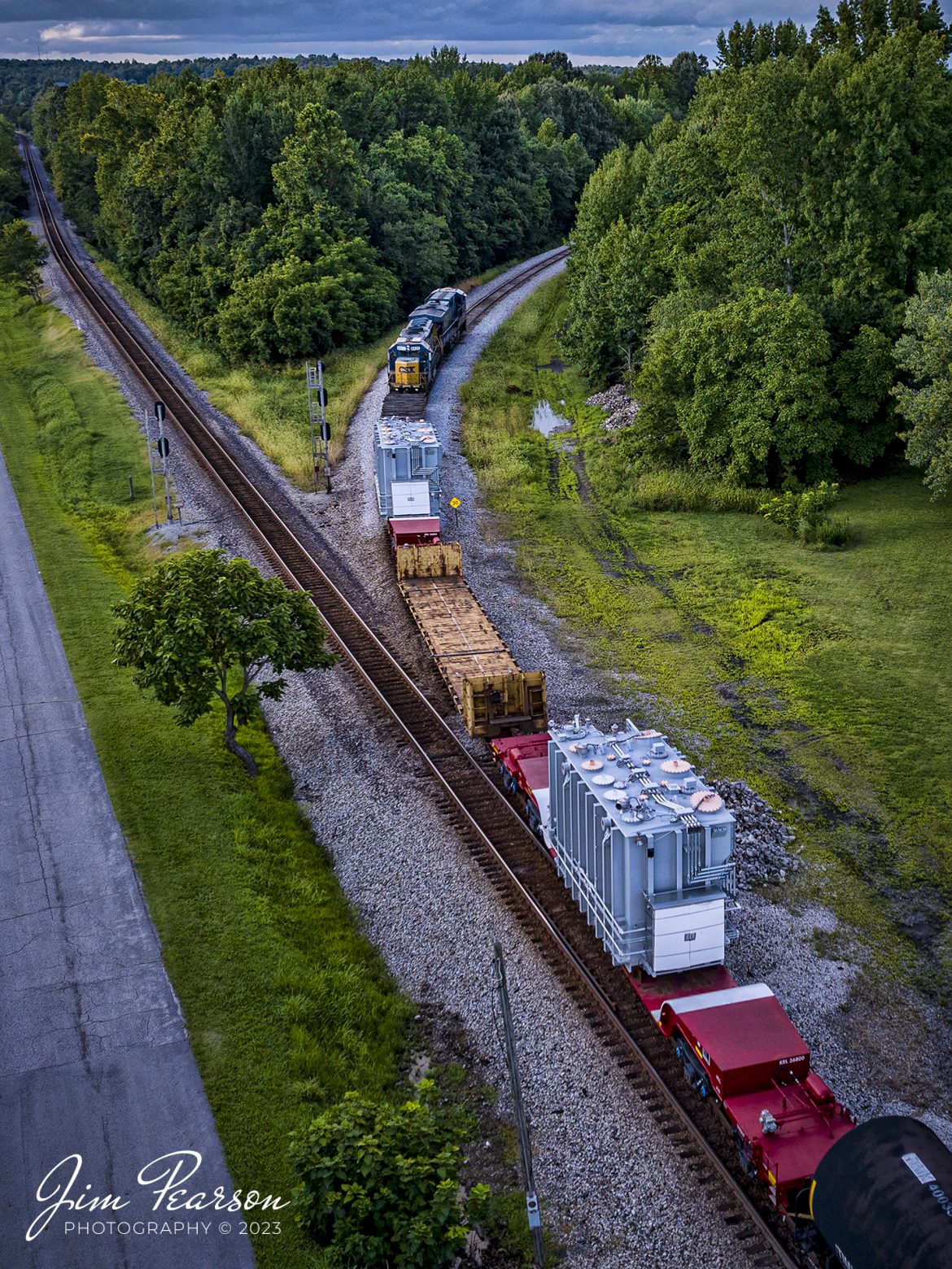 CSX M512 takes the cutoff at Mortons Junction on August 14th, 2023, as it heads north on the Henderson Subdivision with two high/wide transformers as part of their cargo, at Mortons Gap, Kentucky. The track theyre taking cuts off the downtown areas of Earlington and Madisonville, Ky and frees up the main for the dispatcher to run opposing trains.

Tech Info: DJI Mavic 3 Classic Drone, RAW, 24mm, f/2.8, 1/500, ISO 190.

#trainphotography #railroadphotography #trains #railways #dronephotography #trainphotographer #railroadphotographer #jimpearsonphotography #trains #csxt #mavic3classic #drones #trainsfromtheair #trainsfromadrone #MortonsGapKy