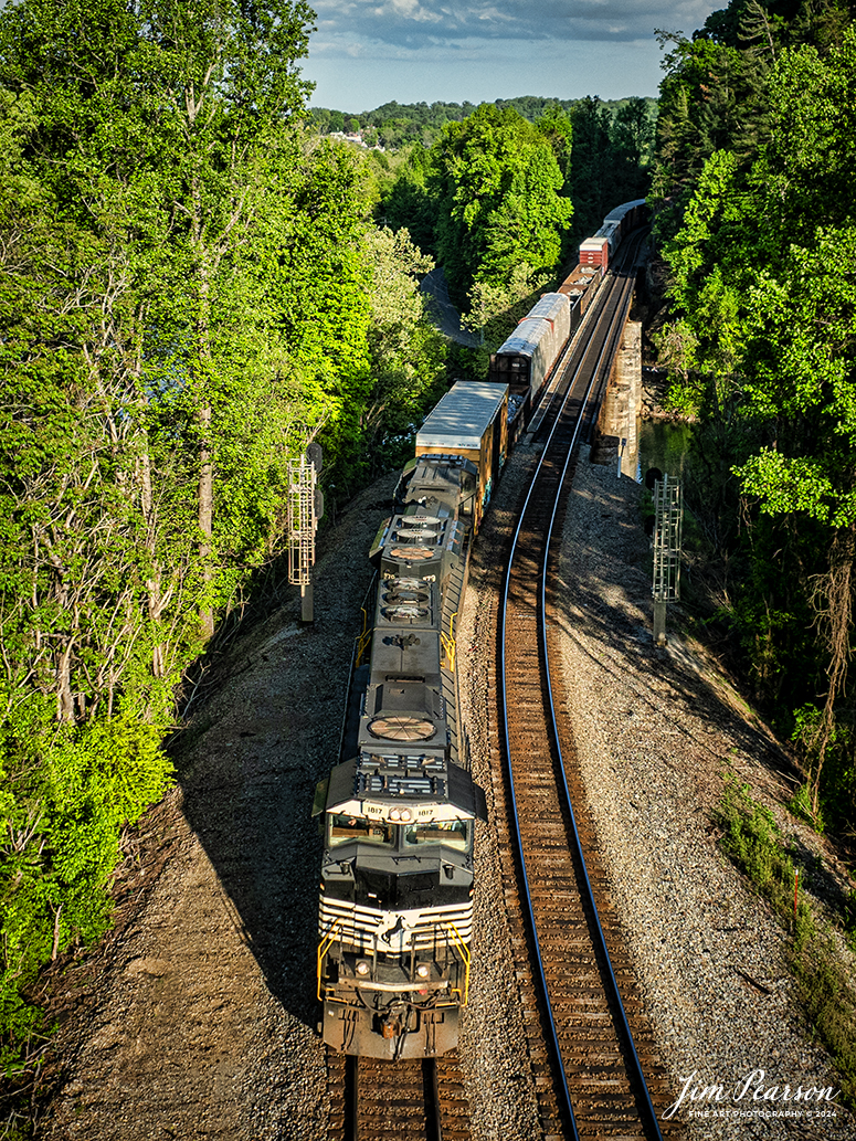 Norfolk Southern 178  crosses the Emory River at Harriman, TN, at Harriman Junction, on the NS CNO&TP (Rathole) Second District as it heads north on April 28th, 2024.

According to American-rails.com, It used to be called the Rathole Division when it was the Southern Railway and is often remembered as a road with relatively flat and tangent main lines due to the region in which it operated. However, the system did feature its share of steep, circuitous main lines such as Saluda Grade in western North Carolina and its famed “Rathole Division” through Kentucky and Tennessee that reached as far north as Cincinnati.

Technically, this stretch of the Southern main line was known as the 2nd District of subsidiary Cincinnati, New Orleans & Texas Pacific (CNO&TP), which was plagued for years by numerous tunnels resulting in its famous nickname by the crews which operated over it.

Over the years the Southern worked to daylight or bypass these obstacles as the route saw significant freight tonnage, a task finally completed during the 1960s. Today, the Rathole remains an important artery in Norfolk Southern’s vast network.

Tech Info: DJI Mavic 3 Classic Drone, RAW, 22mm, f/2.8, 1/1000, ISO 100.

#railroad #railroads #train #trains #bestphoto #railroadengines #picturesoftrains #picturesofrailway #bestphotograph #photographyoftrains #trainphotography #JimPearsonPhotography #nscnotpsubdivision #norfolksouthern #trendingphoto