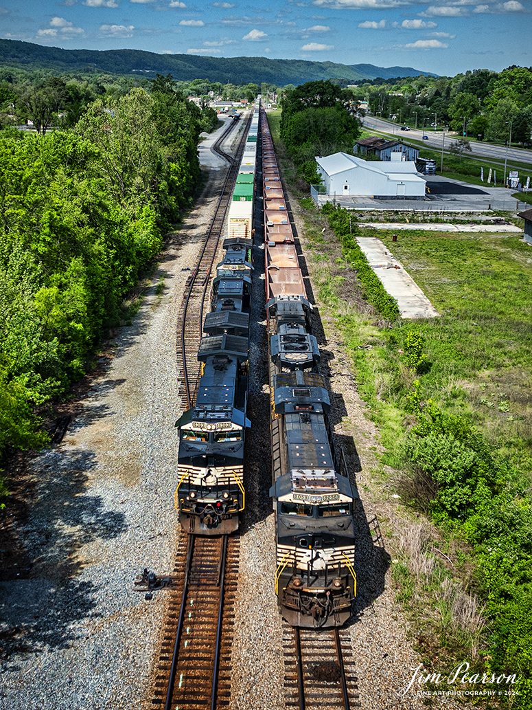 Norfolk Southern Intermodal 29F passes an empty ballast train tied down in a siding Rockwood, Tennessee as they head south on the CNO&TP 3rd District.

According to Wikipedia: The CNO&TP main line has three districts: the First District from Cincinnati, Ohio, to Danville, Kentucky; the Second District from Danville to Oakdale, Tennessee; and the Third District from Oakdale to Chattanooga.

Tech Info: DJI Mavic 3 Classic Drone, RAW, 22mm, f/2.8, 1/2000, ISO 100.

#railroad #railroads #train #trains #bestphoto #railroadengines #picturesoftrains #picturesofrailway #bestphotograph #photographyoftrains #trainphotography #JimPearsonPhotography #nscnotpsubdivision #norfolksouthern #trendingphoto