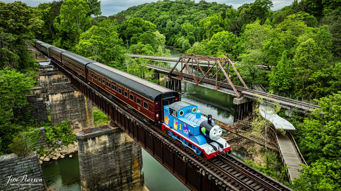 The Iconic Thomas the Tank Engine leads a passenger train over the ...