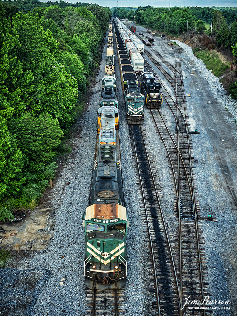 Paducah and Louisville Railway (PAL) 4523 leads an 8,100ft loaded military train as they pull south from West Yard after a crew change at Madisonville, Kentucky, on May 17th, 2024. 

Tech Info: DJI Mavic 3 Classic Drone, RAW, 22mm, f/2.8, 1/1000, ISO 200.

#railroad #railroads #train #trains #bestphoto #railroadengines #picturesoftrains #picturesofrailway #bestphotograph #photographyoftrains #trainphotography #JimPearsonPhotography #trendingphoto #militarytrain #pal #paducahandlouisvillerailway