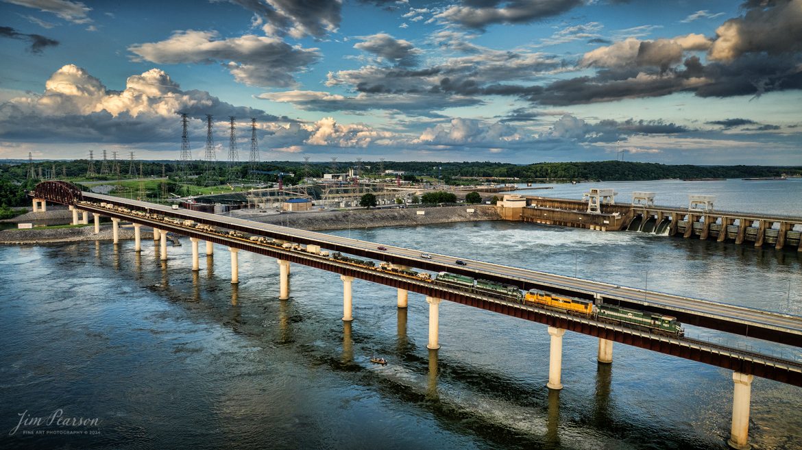 Paducah and Louisville Railway (PAL) 4523, 4142, 2101 and 2104, lead an 8,100ft military train across the Tennessee River at Kentucky Dam at Gilbertsville, Kentucky, on May 17th, 2024. I couldn’t ask for a more beautiful day to capture a train here at this location. 

The crew took the train on to Paducah, Ky where it was tied down for the night. Where it went beyond there I’ve not heard, but in the past BNSF has picked up these moves and took them on west.

Tech Info: DJI Mavic 3 Classic Drone, RAW, 22mm, f/2.8, 1/600, ISO 150.

#railroad #railroads #train #trains #bestphoto #railroadengines #picturesoftrains #picturesofrailway #bestphotograph #photographyoftrains #trainphotography #JimPearsonPhotography #trendingphoto #militarytrain #pal #paducahandlouisvillerailway