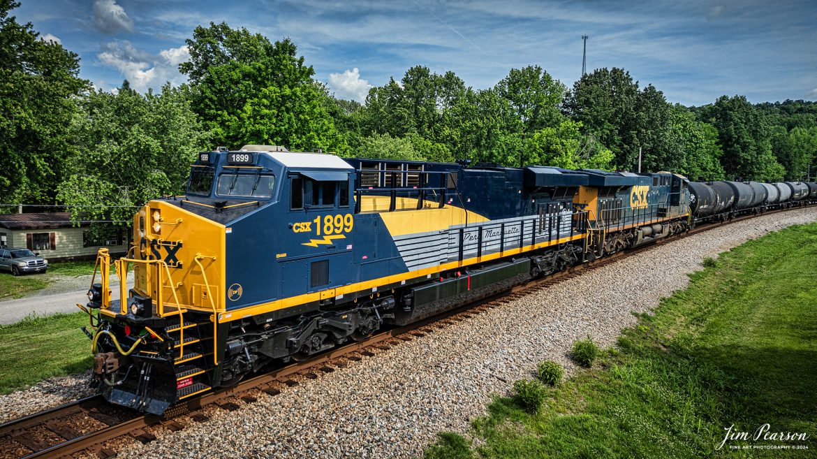 CSX M502 heads northbound with CSX Pere Marquette Heritage Unit, 1899, leading the way along the CSX Henderson Subdivision, on May 20th, 2024. This is number ten heritage catch for me for this series of locomotives from CSX, and I look forward to catching the others!

According to a CSX Press Release: May 1, 2024 - CSX has introduced the latest addition in its heritage locomotive series, paying homage to the rich history of the Pere Marquette Railroad. This new unit showcases the Pere Marquette's legacy, dating back to its inception on November 1, 1899.
 
The Pere Marquette Railroad, operating in the Great Lakes region of the United States and parts of southern Ontario, Canada, derived its name from Jacques Marquette, a notable French Jesuit missionary credited with founding Michigan's first European settlement in Sault Ste Marie. After years of operation, the company merged with the Chesapeake and Ohio Railway (C&O) on June 6, 1947, eventually becoming part of the renowned CSX network.
 
The design of the Pere Marquette heritage locomotive was meticulously crafted by employees at the CSX Waycross Locomotive Shop. According to CSX Carman Painter Eric Lee, “We had to measure each stripe precisely and position the words just right to ensure it captured the look of the original design. It took us about four days just to lay out the stripes before we could begin painting.”
 
A fascinating tidbit related to the history of Pere Marquette is its cameo in the 2004 film "The Polar Express." The steam locomotive Pere Marquette 1225 served as the inspiration for the train depicted in the movie, with audio recordings of the actual locomotive in operation featured in the film. Interestingly, the locomotive had been donated to Michigan State University and was exhibited near the university's football stadium. The author of "The Polar Express" book drew inspiration from seeing this locomotive on display during childhood, solidifying its place in popular culture.
 
CSX's dedication to honoring the history and significance of the Pere Marquette Railroad through this new locomotive underscores the company's commitment to preserving and celebrating the heritage of American railroads. Keep an eye out as this remarkable piece of history moves across the CSX network, bridging the past with the present.

Tech Info: DJI Mavic 3 Classic Drone, RAW, 22mm, f/2.8, 1/2000, ISO 150.

#railroad #railroads #train, #trains #railway #railway #steamtrains #railtransport #railroadengines #picturesoftrains #picturesofrailways #besttrainphotograph #bestphoto #photographyoftrains #steamtrainphotography #CSXPereMarquetteheritageunit #bestsoldpicture #JimPearsonPhotography #csxheritagelocomotive