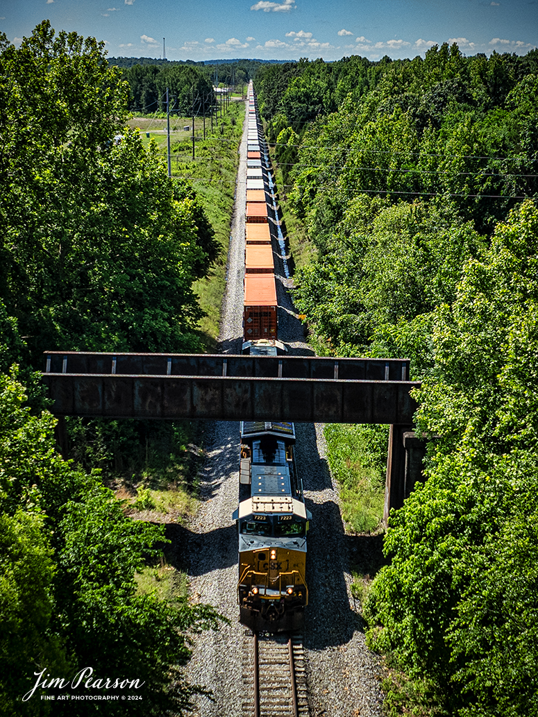 CSXT 7223 leads CSX intermodal I128 north under the overpass for the Paducah and Louisville Railway, just south of CP East Diamond at Madisonville, Kentucky, on the CSX Henderson Subdivision cutoff that bypasses downtown Earlington and Madisonville, Kentucky, on May 30th, 2024.

Tech Info: DJI Mavic 3 Classic Drone, RAW, 22mm, f/2.8, 1/2000, ISO 140.

#railroad #railroads #train #trains #bestphoto #railroadengines #picturesoftrains #picturesofrailway #bestphotograph #photographyoftrains #trainphotography #JimPearsonPhotography #trendingphoto #csxt #trainsfromadrone