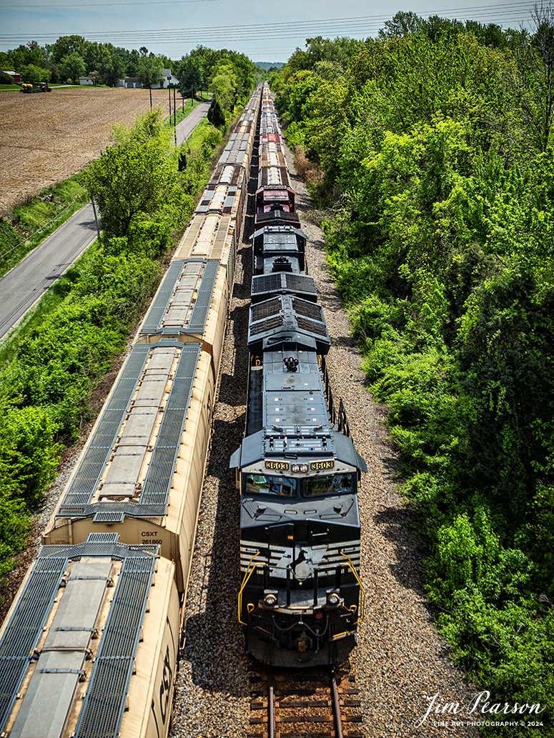 Norfolk Southern 3603 leads B231 northbound as it passes grain train G413 at Robards, Kentucky, on April 20th, 2024, on the Henderson Subdivision. B231 is a loaded phosphate train that runs from Mulberry, FL to Bensenville, IL (CPKC). G413 is a loaded grain train that runs from Evansville, IN	S&N Yard at Montgomery, AL.

Tech Info: DJI Mavic 3 Classic Drone, RAW, 22mm, f/2.8, 1/2000, ISO 140.

#railroad #railroads #train #trains #bestphoto #railroadengines #picturesoftrains #picturesofrailway #bestphotograph #photographyoftrains #trainphotography #JimPearsonPhotography #trendingphoto #csxt #trainsfromadrone