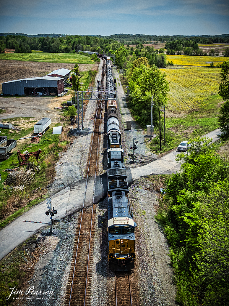 CSXT 7003 leads M502 as it passes through CP Anaconda as it heads north at Robards, Kentucky, on April 20th, 2024, on the Henderson Subdivision. M502 runs daily between Radnor Yard in Nashville, TN to Clearing Yard in Chicago, IL.

Tech Info: DJI Mavic 3 Classic Drone, RAW, 22mm, f/2.8, 1/2500, ISO 120.

#railroad #railroads #train #trains #bestphoto #railroadengines #picturesoftrains #picturesofrailway #bestphotograph #photographyoftrains #trainphotography #JimPearsonPhotography #trendingphoto #csxt #trainsfromadrone