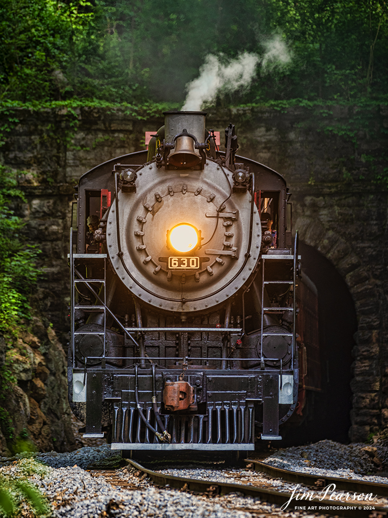 Tennessee Valley Railroad Museum’s steam locomotive Southern Railway 630 exits Missionary Ridge Tunnel as it approaches East Chattanooga, Tennessee with a trainload of passengers, on April 27th, 2024. 

According to Wikipedia: Southern Railway 630 is a 2-8-0 "Consolidation" type steam locomotive built in February 1904 by the American Locomotive Company (ALCO) of Richmond, Virginia for the Southern Railway as a member of the Ks-1 class. It is currently owned and operated by the Tennessee Valley Railroad Museum in Chattanooga, Tennessee where it resides today for use on excursion trains.

According to the Tennessee River Valley Tourism site: Tennessee Valley Railroad Museum's passenger trains run on an historic route which includes Missionary Ridge Tunnel, completed in 1858 and on the National Register of Historic Places. The tunnel is the primary reason TVRM runs on the three-mile section of the former Southern Railway. As railroad equipment grew too large to pass through, the single-track tunnel became a traffic jam for an other wise double-track railroad. Southern Railway abandoned the three-mile portion of the line and built a new section around the end of Missionary Ridge, avoiding the tunnel altogether. TVRM restored rails through the tunnel in 1971 and continues to use the pre-Civil War Tunnel daily.

Tech Info: Nikon D800, Sigma 150-600 @ 450mm, f/5.6, 1/320, ISO 450.

#trainphotography #railroadphotography #trains #railways #trainphotographer #railroadphotographer #jimpearsonphotography #PassengerTrain #TennesseeValleyRailroadMuseum #TennesseeTrains #steamtrain #tvrm