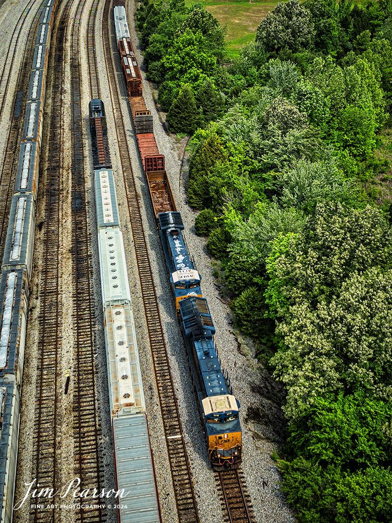 CSX M512 heads south along the power siding at CSX Atkinson Yard in Madisonville, Kentucky on May 7th, 2024, as they head south on the CSX Henderson Subdivision.

Tech Info: DJI Mavic 3 Classic Drone, RAW, 22mm, f/2.8, 1/1000, ISO 100.

#trainphotography #railroadphotography #trains #railways #trainphotographer #railroadphotographer #jimpearsonphotography #CSXT #KentuckyTrains