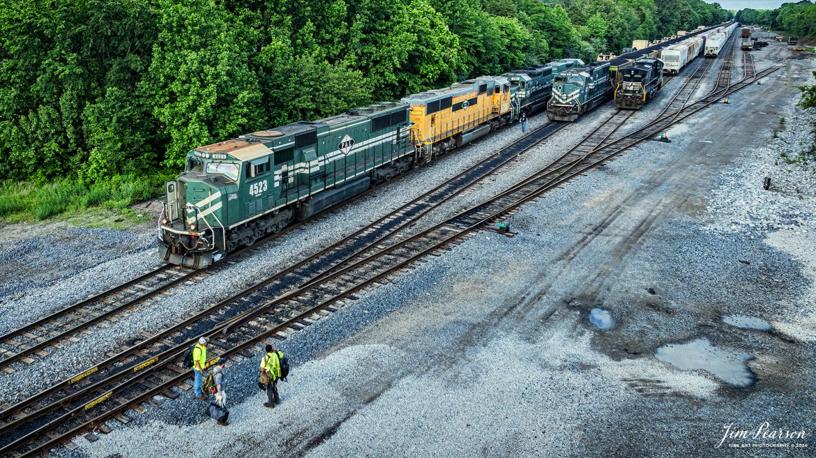 Paducah and Louisville Railway (PAL) 4523 leads an 8,100ft loaded military train as a crew change takes place at West Yard in Madisonville, Kentucky, on May 17th, 2024. 

According to Wikipedia: The Paducah & Louisville Railway (reporting mark PAL) is a Class II railroad that operates freight service between Paducah and Louisville, Kentucky. The line is located entirely within the Commonwealth of Kentucky. The 270-mile (430 km) line was purchased from Illinois Central Gulf Railroad in August 1986.

Tech Info: DJI Mavic 3 Classic Drone, RAW, 22mm, f/2.8, 1/1000, ISO 200.

#railroad #railroads #train #trains #bestphoto #railroadengines #picturesoftrains #picturesofrailway #bestphotograph #photographyoftrains #trainphotography #JimPearsonPhotography #trendingphoto #militarytrain #pal #paducahandlouisvillerailway