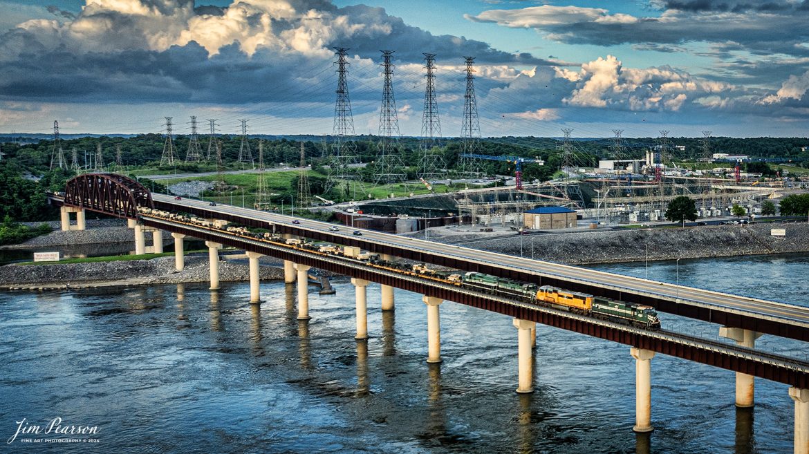 Paducah and Louisville Railway (PAL) 4523, 4142, 2101 and 2104, lead an 8,100ft military train across the Tennessee River at Kentucky Dam at Gilbertsville, Kentucky, on May 17th, 2024.

The crew took the train on to Paducah, Ky where it was tied down for the night. Where it went beyond there I’ve not heard, but in the past BNSF has picked up these moves and took them on west.

Tech Info: DJI Mavic 3 Classic Drone, RAW, 22mm, f/2.8, 1/500, ISO 160.

#railroad #railroads #train #trains #bestphoto #railroadengines #picturesoftrains #picturesofrailway #bestphotograph #photographyoftrains #trainphotography #JimPearsonPhotography #trendingphoto #militarytrain #pal #paducahandlouisvillerailway