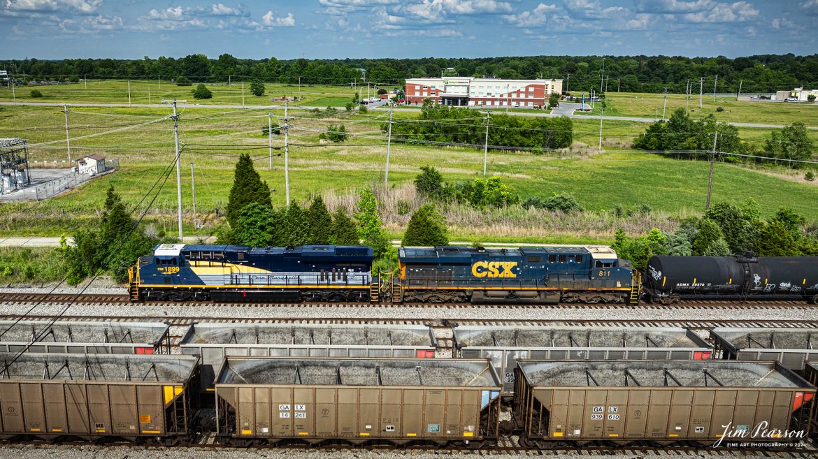 CSX M502 through the south end of Atkinson Yard at Madisonville, Ky with CSX Pere Marquette Heritage Unit, 1899, leading the way on the CSX Henderson Subdivision, on May 20th, 2024.

According to a CSX Press Release: May 1, 2024 - CSX has introduced the latest addition in its heritage locomotive series, paying homage to the rich history of the Pere Marquette Railroad. This new unit showcases the Pere Marquette's legacy, dating back to its inception on November 1, 1899.
 
The Pere Marquette Railroad, operating in the Great Lakes region of the United States and parts of southern Ontario, Canada, derived its name from Jacques Marquette, a notable French Jesuit missionary credited with founding Michigan's first European settlement in Sault Ste Marie. After years of operation, the company merged with the Chesapeake and Ohio Railway (C&O) on June 6, 1947, eventually becoming part of the renowned CSX network.
 
The design of the Pere Marquette heritage locomotive was meticulously crafted by employees at the CSX Waycross Locomotive Shop. According to CSX Carman Painter Eric Lee, “We had to measure each stripe precisely and position the words just right to ensure it captured the look of the original design. It took us about four days just to lay out the stripes before we could begin painting.”
 
A fascinating tidbit related to the history of Pere Marquette is its cameo in the 2004 film "The Polar Express." The steam locomotive Pere Marquette 1225 served as the inspiration for the train depicted in the movie, with audio recordings of the actual locomotive in operation featured in the film. Interestingly, the locomotive had been donated to Michigan State University and was exhibited near the university's football stadium. The author of "The Polar Express" book drew inspiration from seeing this locomotive on display during childhood, solidifying its place in popular culture.
 
CSX's dedication to honoring the history and significance of the Pere Marquette Railroad through this new locomotive underscores the company's commitment to preserving and celebrating the heritage of American railroads. Keep an eye out as this remarkable piece of history moves across the CSX network, bridging the past with the present.

Tech Info: DJI Mavic 3 Classic Drone, RAW, 22mm, f/2.8, 1/1600, ISO 100.

#railroad #railroads #train, #trains #railway #railway #steamtrains #railtransport #railroadengines #picturesoftrains #picturesofrailways #besttrainphotograph #bestphoto #photographyoftrains #steamtrainphotography #CSXPereMarquetteheritageunit #bestsoldpicture #JimPearsonPhotography #csxheritagelocomotive